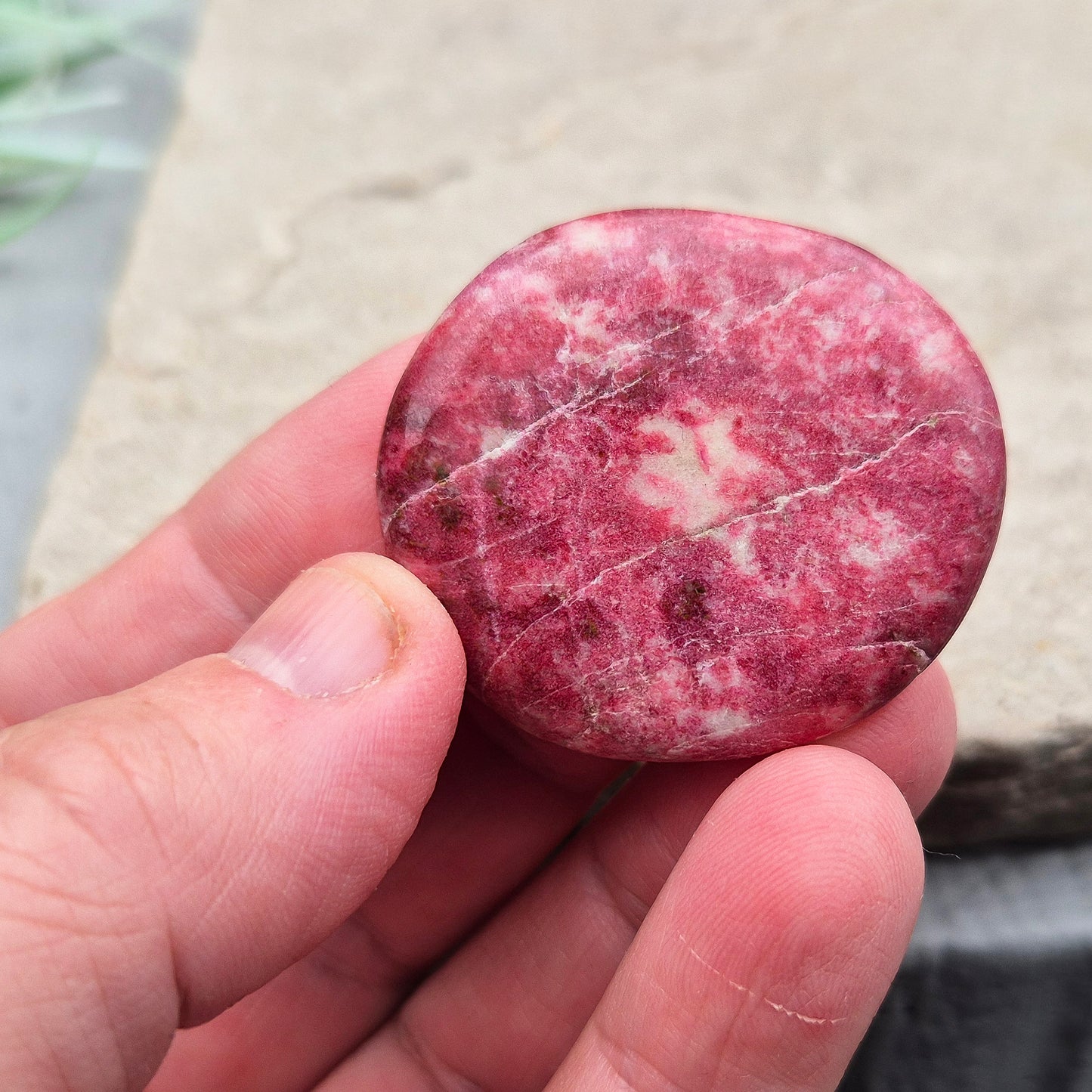 This beautiful Pink Thulite palm stone, also known as Rosaline, features a vibrant natural pink colour and fits comfortably in your hand. Pink Thulite is celebrated for its warm, uplifting energy.