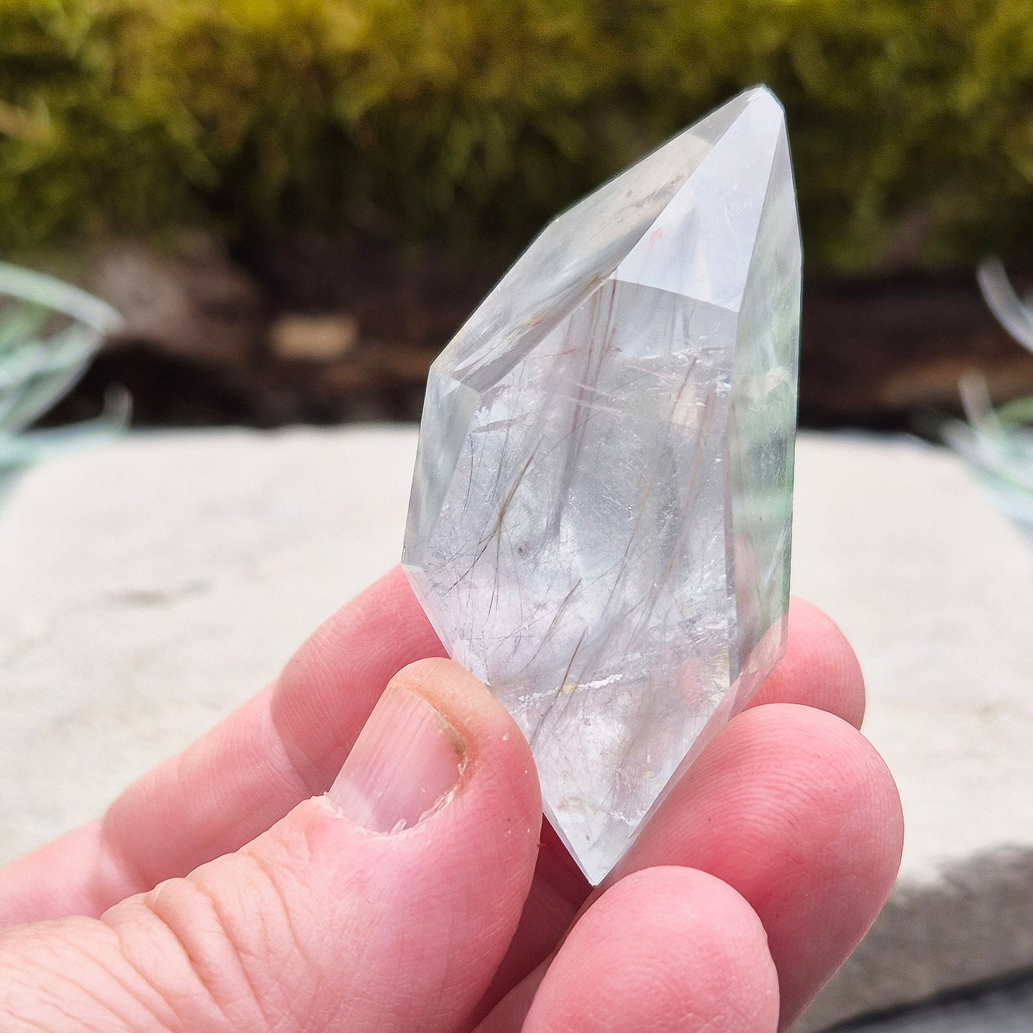 Blue Tara, also known as Indicolite Quartz, is a rare and captivating crystal featuring natural Blue Tourmaline inclusions within Quartz. This rare crystal combination-featuring fine blue needles to misty, cloud-like patterns