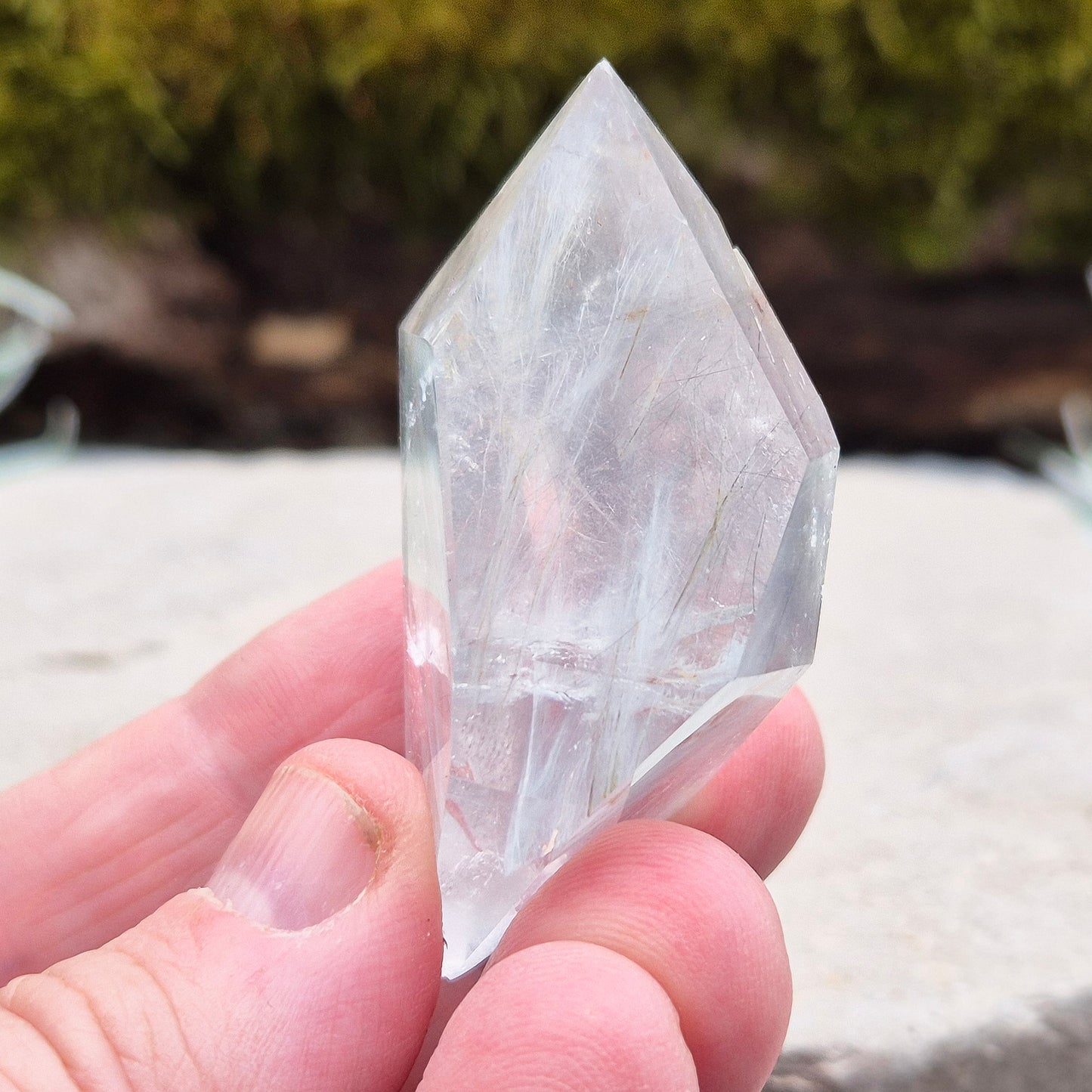 Blue Tara, also known as Indicolite Quartz, is a rare and captivating crystal featuring natural Blue Tourmaline inclusions within Quartz. This rare crystal combination-featuring fine blue needles to misty, cloud-like patterns