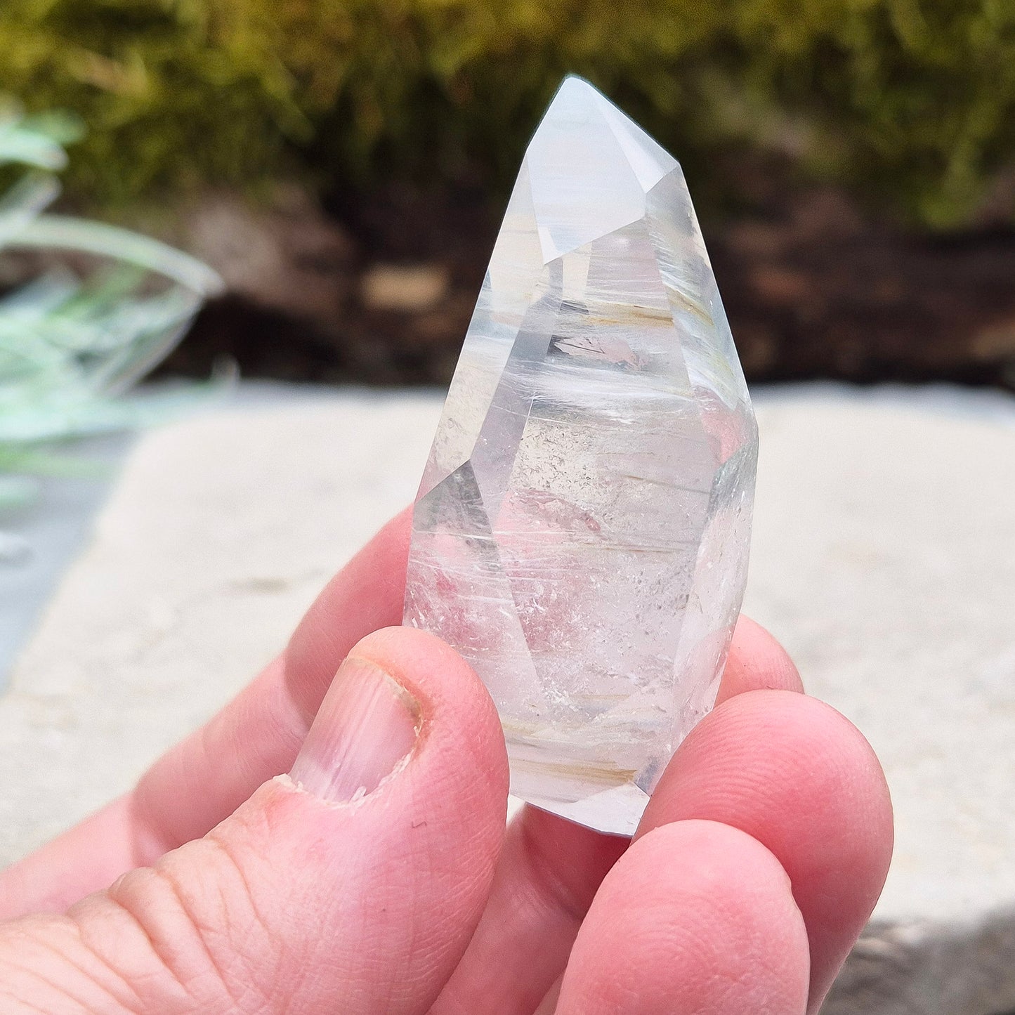 Blue Tara, also known as Indicolite Quartz, is a rare and captivating crystal featuring natural Blue Tourmaline inclusions within Quartz. This rare crystal combination-featuring fine blue needles to misty, cloud-like patterns