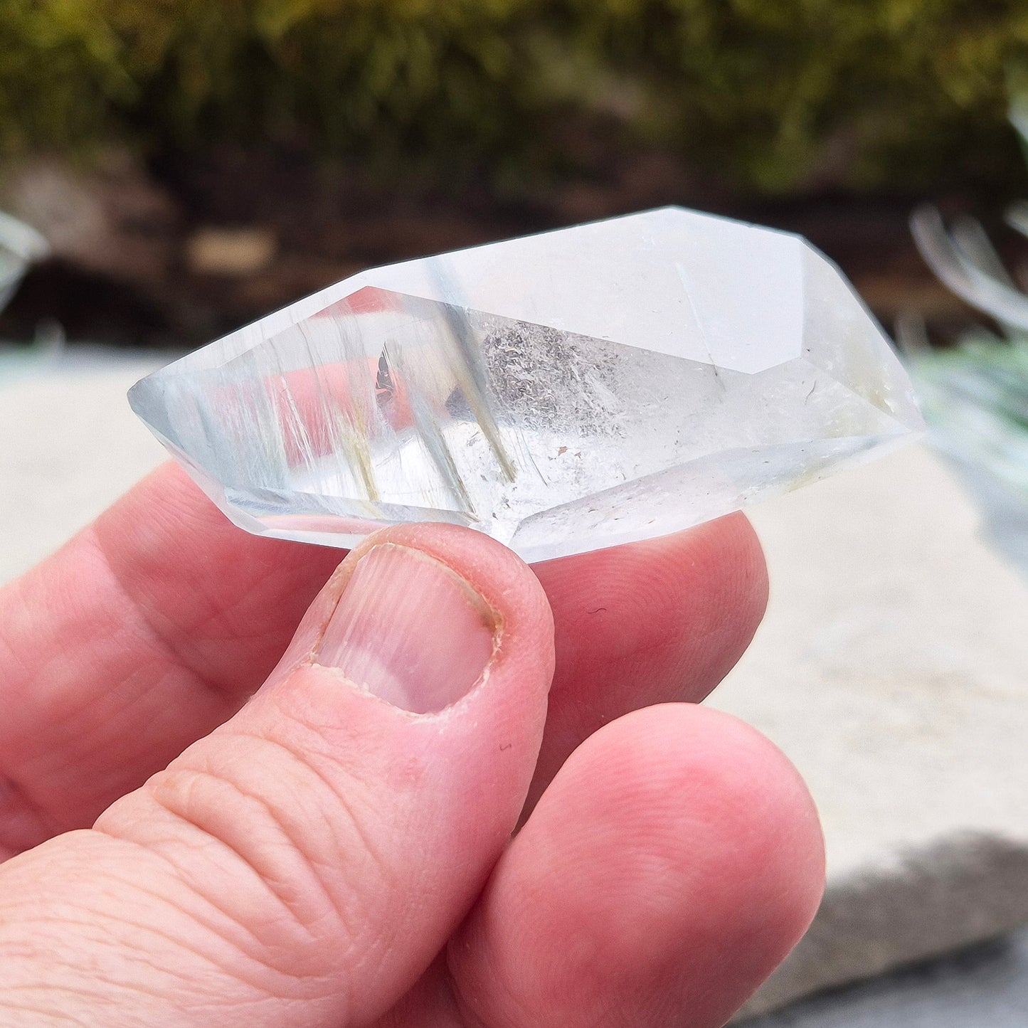 Blue Tara, also known as Indicolite Quartz, is a rare and captivating crystal featuring natural Blue Tourmaline inclusions within Quartz. This rare crystal combination-featuring fine blue needles to misty, cloud-like patterns