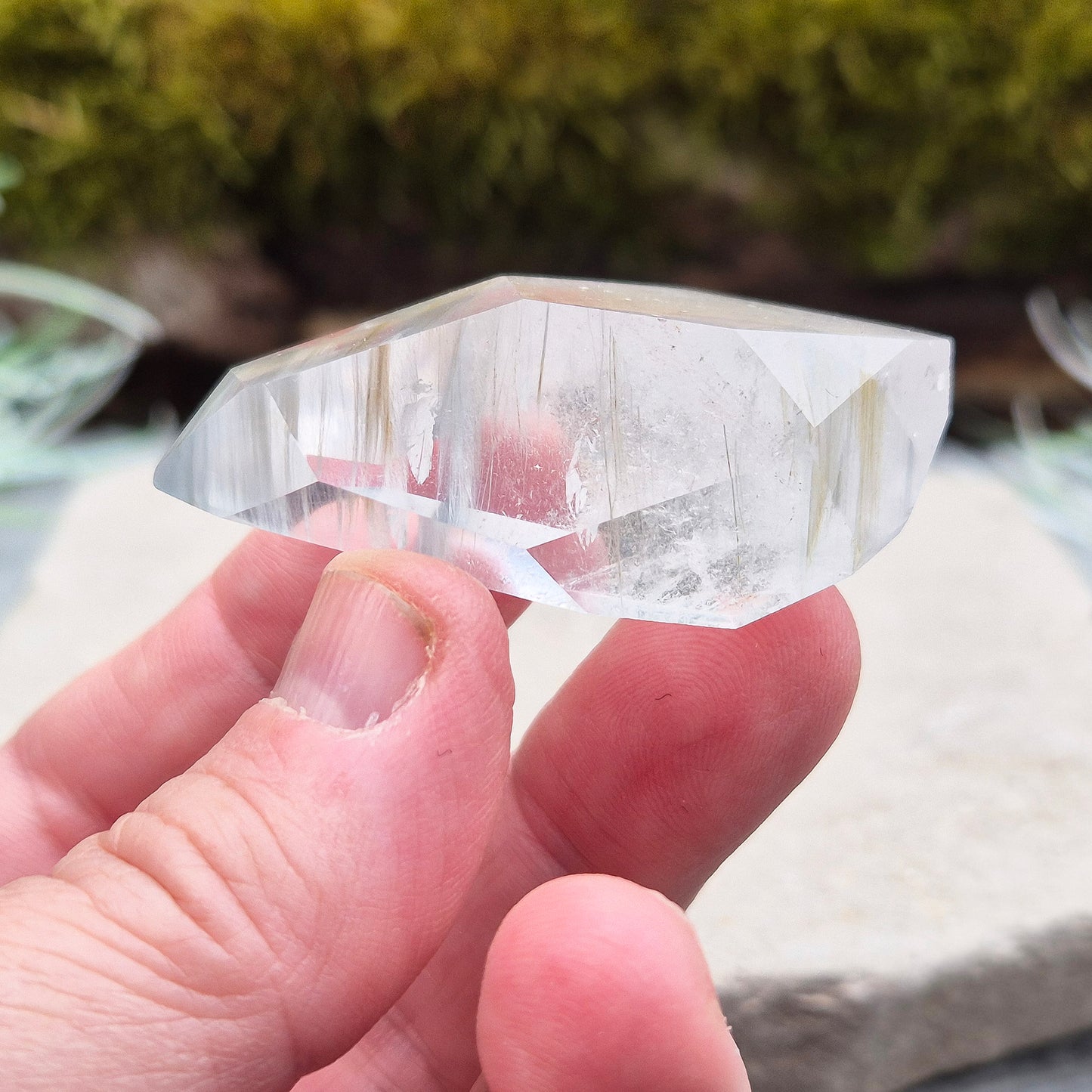 Blue Tara, also known as Indicolite Quartz, is a rare and captivating crystal featuring natural Blue Tourmaline inclusions within Quartz. This rare crystal combination-featuring fine blue needles to misty, cloud-like patterns