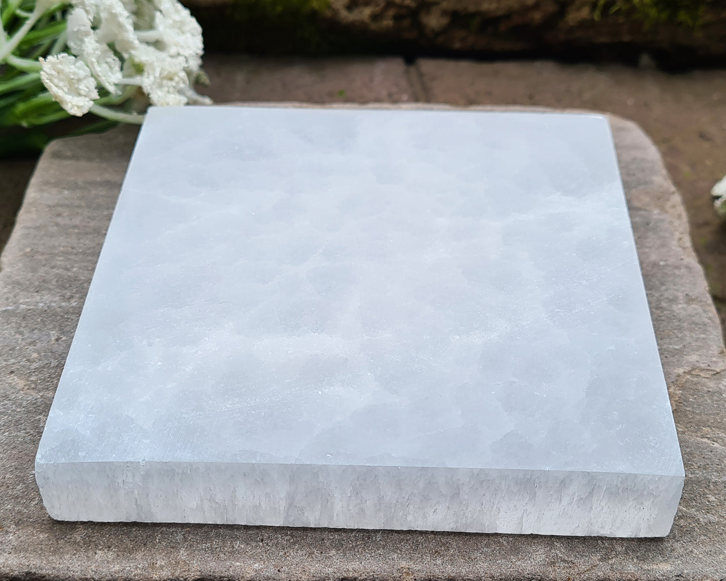 These fully polished Selenite plates are perfect for cleansing and recharging your crystals. Simply place your stones on the plate — Selenite naturally clears stagnant or negative energy and revitalises their energy. It also makes a lovely display base for showcasing your favourite crystals.