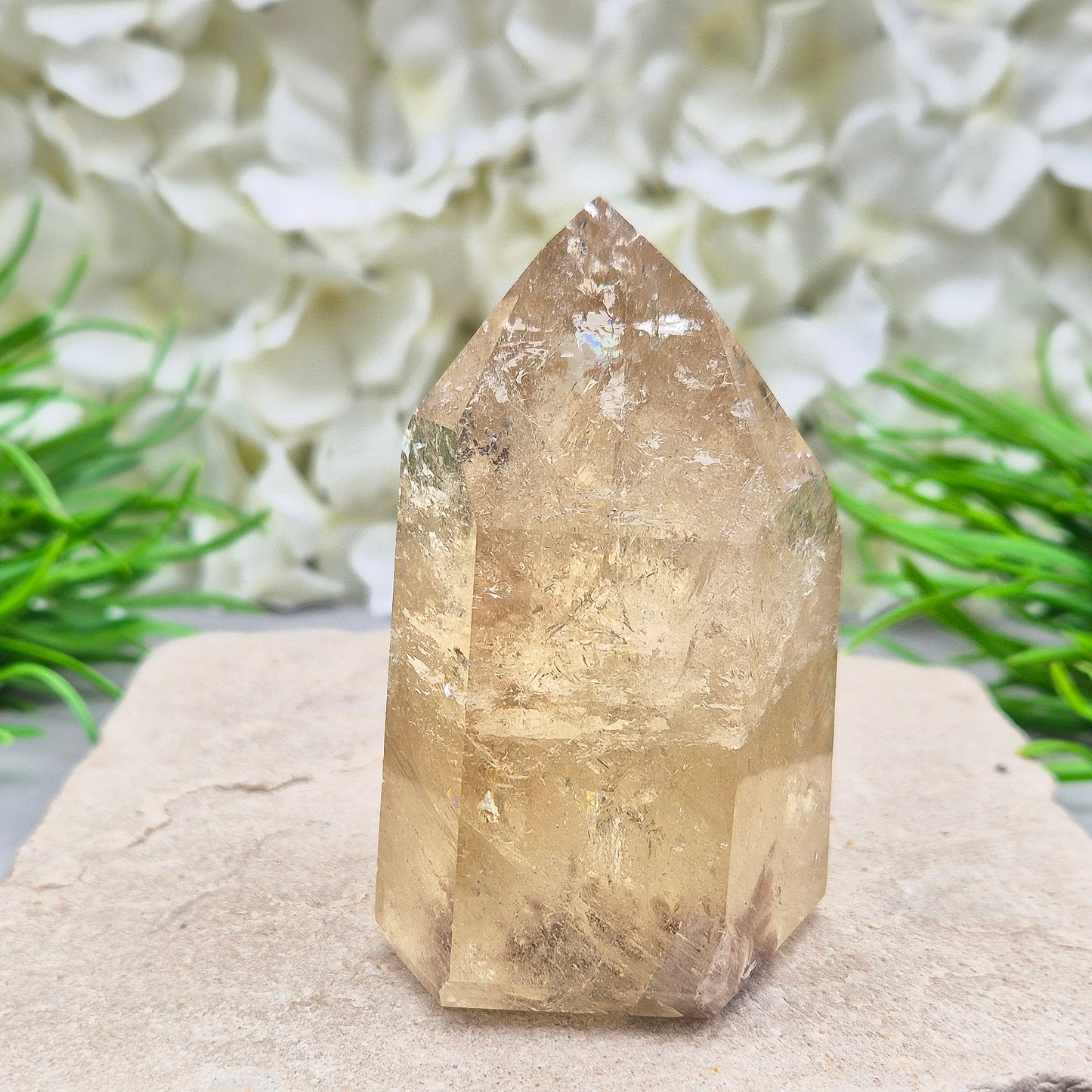 Natural Untreated polished Citrine Point sourced and polished in Brazil. Wonderful citrine colour with light reflecting inclusions and I have seen a few rainbows within it. Finding natural citrine is becoming more difficult so I am delighted to have this piece.