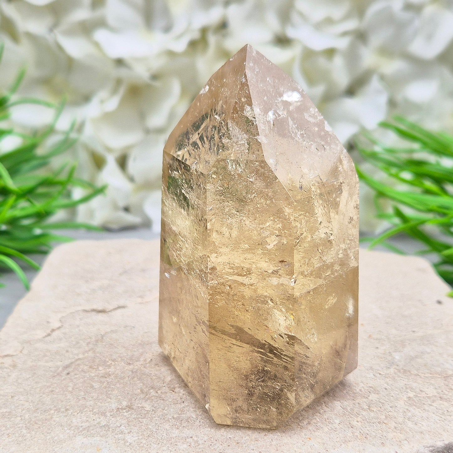 Natural Untreated polished Citrine Point sourced and polished in Brazil. Wonderful citrine colour with light reflecting inclusions and I have seen a few rainbows within it. Finding natural citrine is becoming more difficult so I am delighted to have this piece.