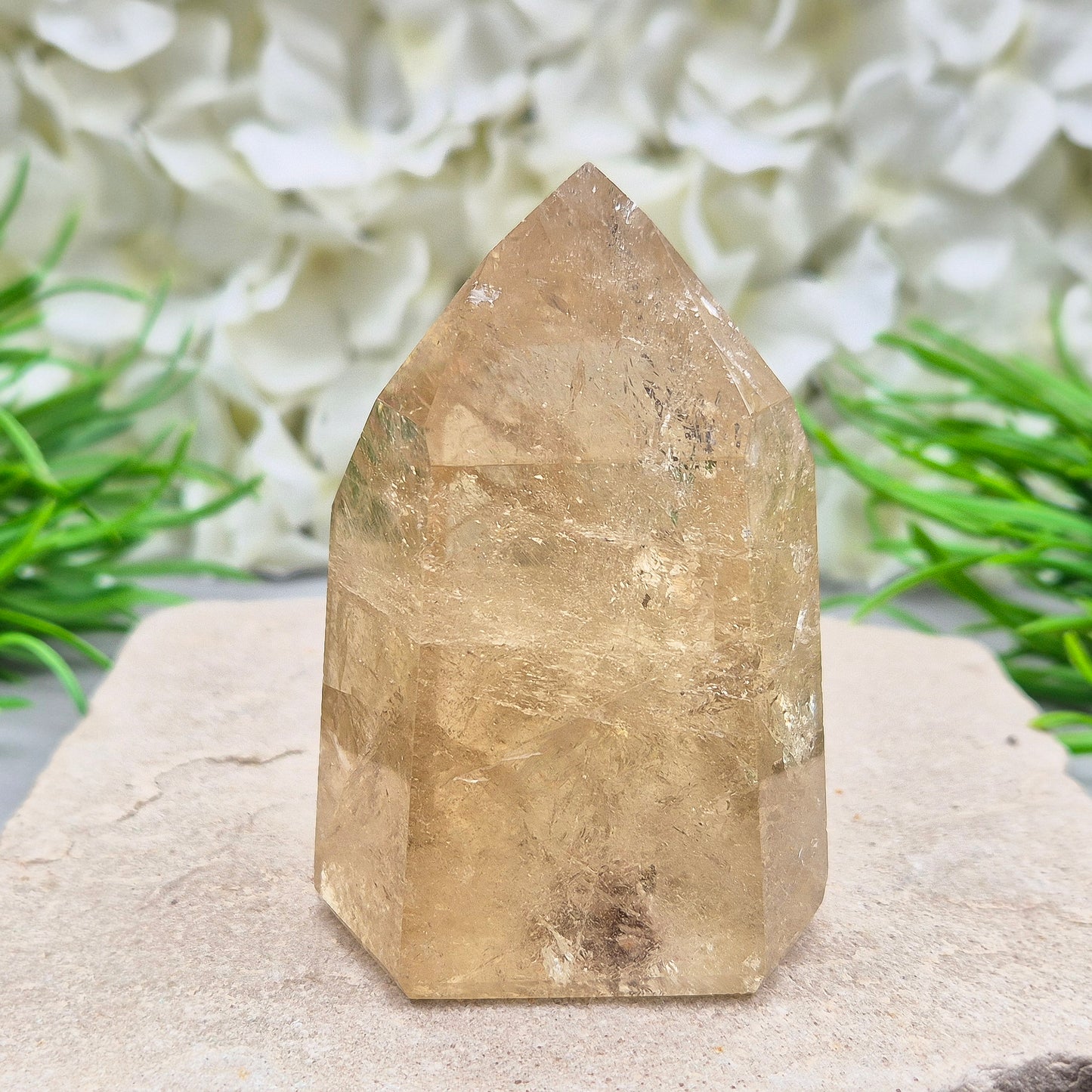 Natural Untreated polished Citrine Point sourced and polished in Brazil. Wonderful citrine colour with light reflecting inclusions and I have seen a few rainbows within it. Finding natural citrine is becoming more difficult so I am delighted to have this piece.