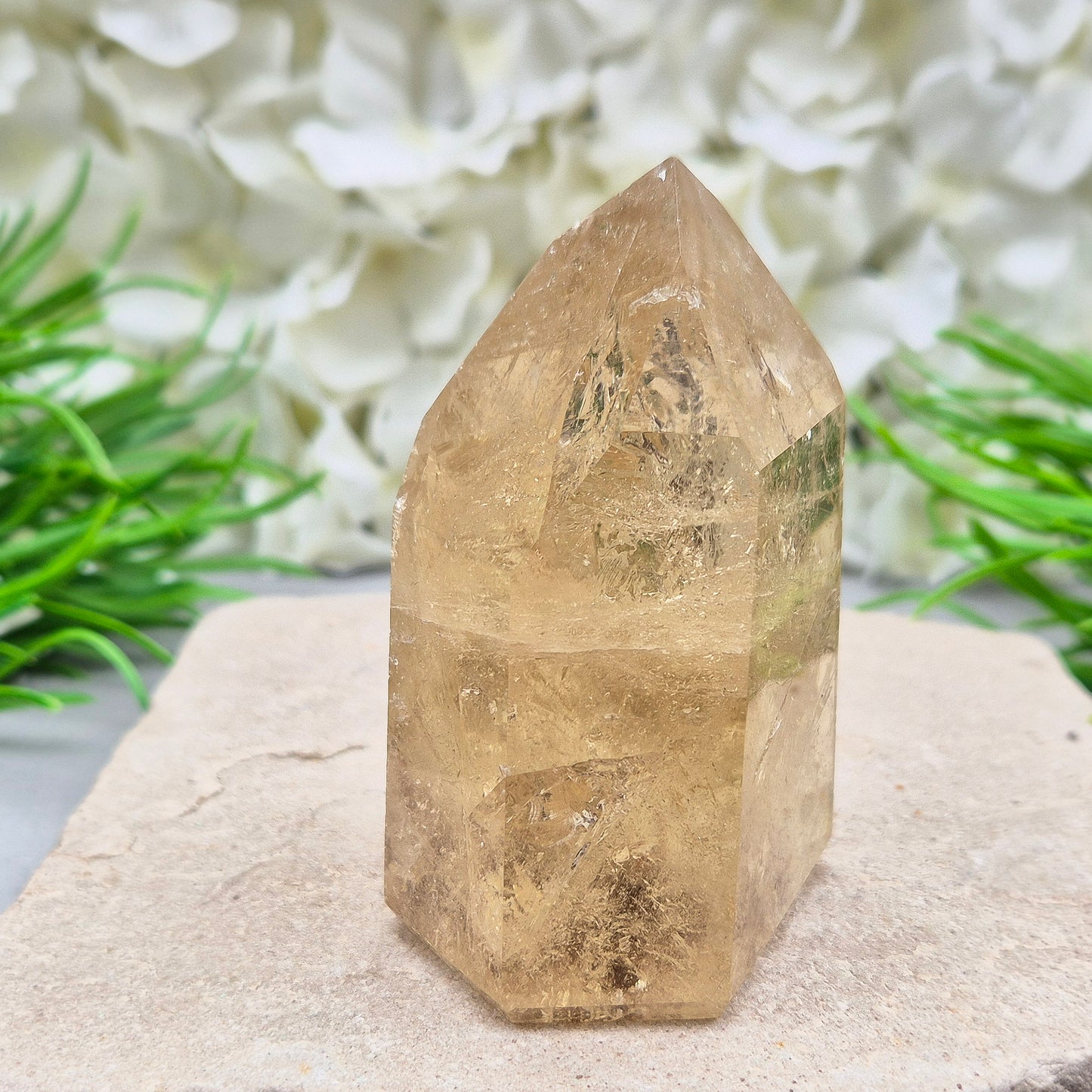 Natural Untreated polished Citrine Point sourced and polished in Brazil. Wonderful citrine colour with light reflecting inclusions and I have seen a few rainbows within it. Finding natural citrine is becoming more difficult so I am delighted to have this piece.