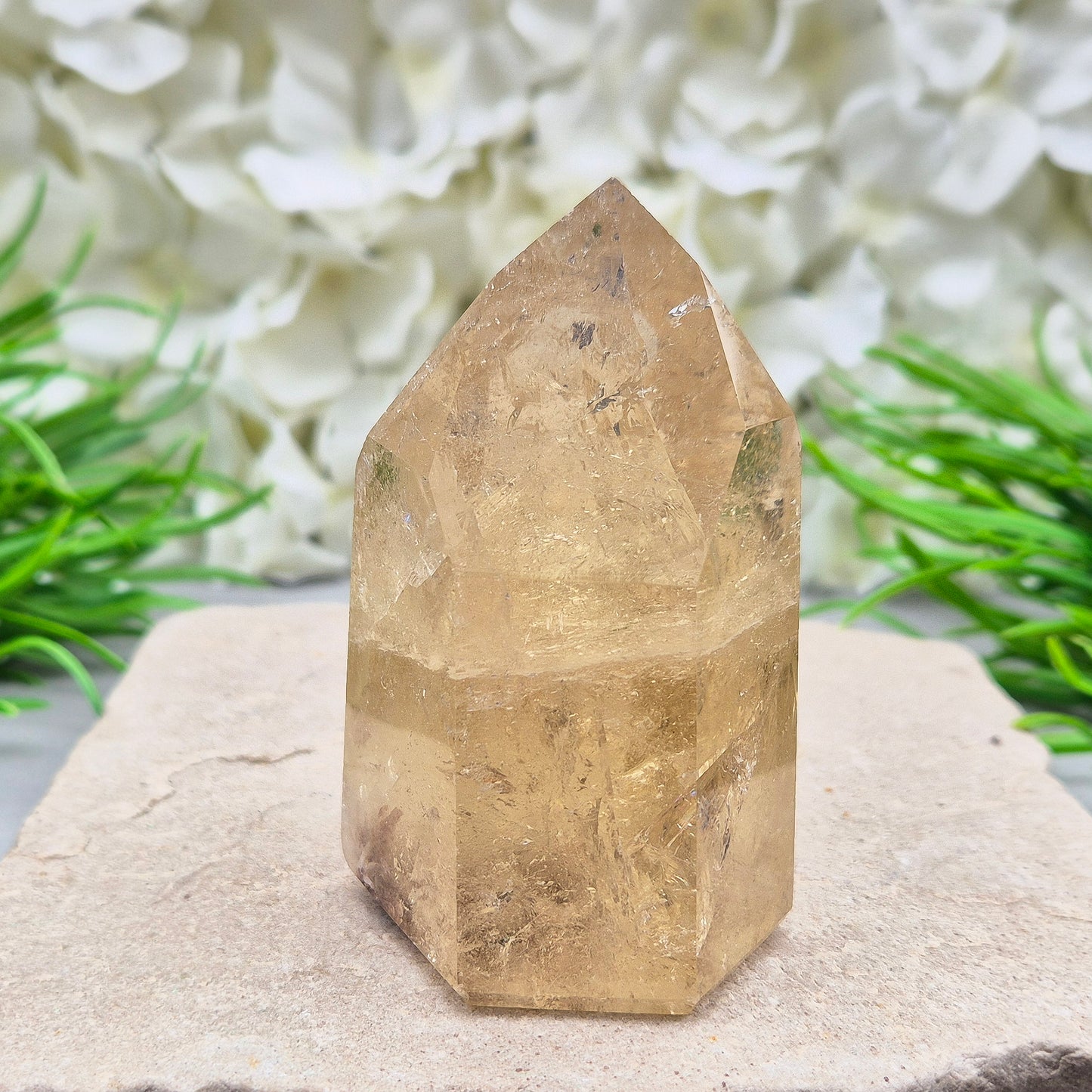 Natural Untreated polished Citrine Point sourced and polished in Brazil. Wonderful citrine colour with light reflecting inclusions and I have seen a few rainbows within it. Finding natural citrine is becoming more difficult so I am delighted to have this piece.