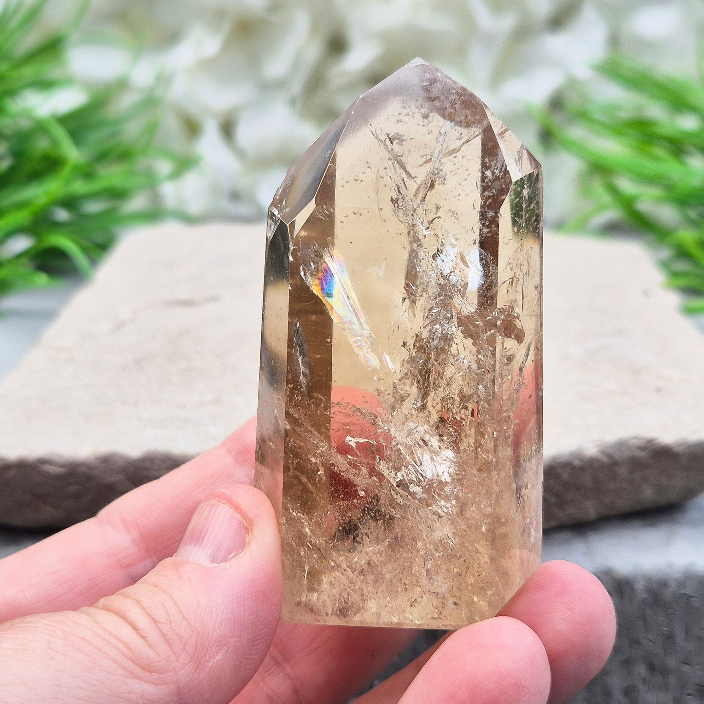 Natural Untreated polished Citrine Point sourced and polished in Brazil. Wonderful citrine colour with light reflecting inclusions and a rainbow within it. Finding natural citrine is becoming more difficult so I am delighted to have this piece. Reduced as it has a small nick on one of the sides of the point so reduced from £75.75 to £61.25