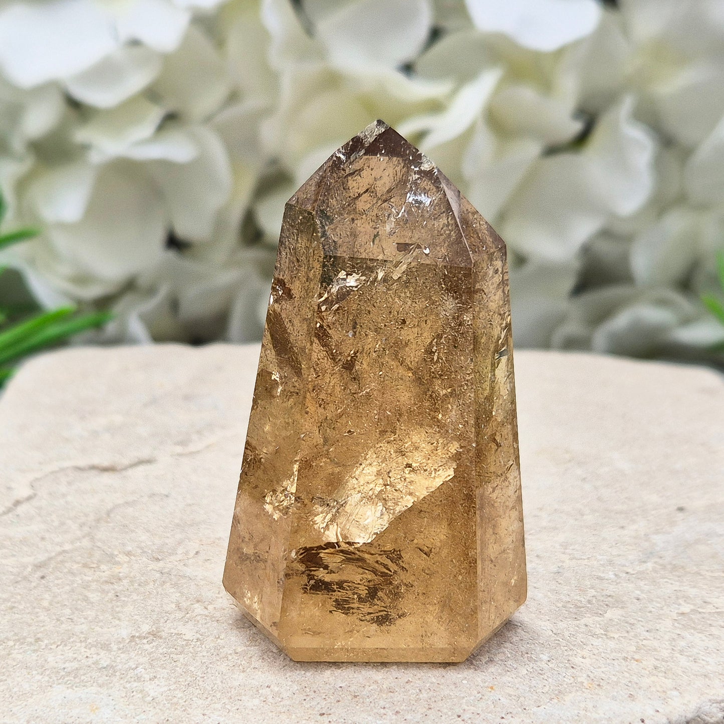 Natural Untreated polished Citrine Point sourced and polished in Brazil. Wonderful dark honey citrinecolour with light reflecting inclusions.