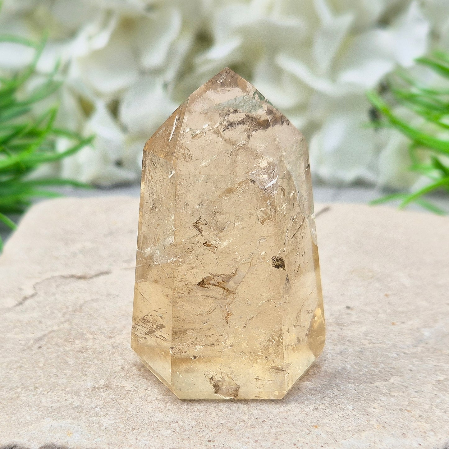 Natural Untreated polished Citrine Point sourced and polished in Brazil. Wonderful light honey citrine colour with light reflecting inclusions and a natural fissure at the back.