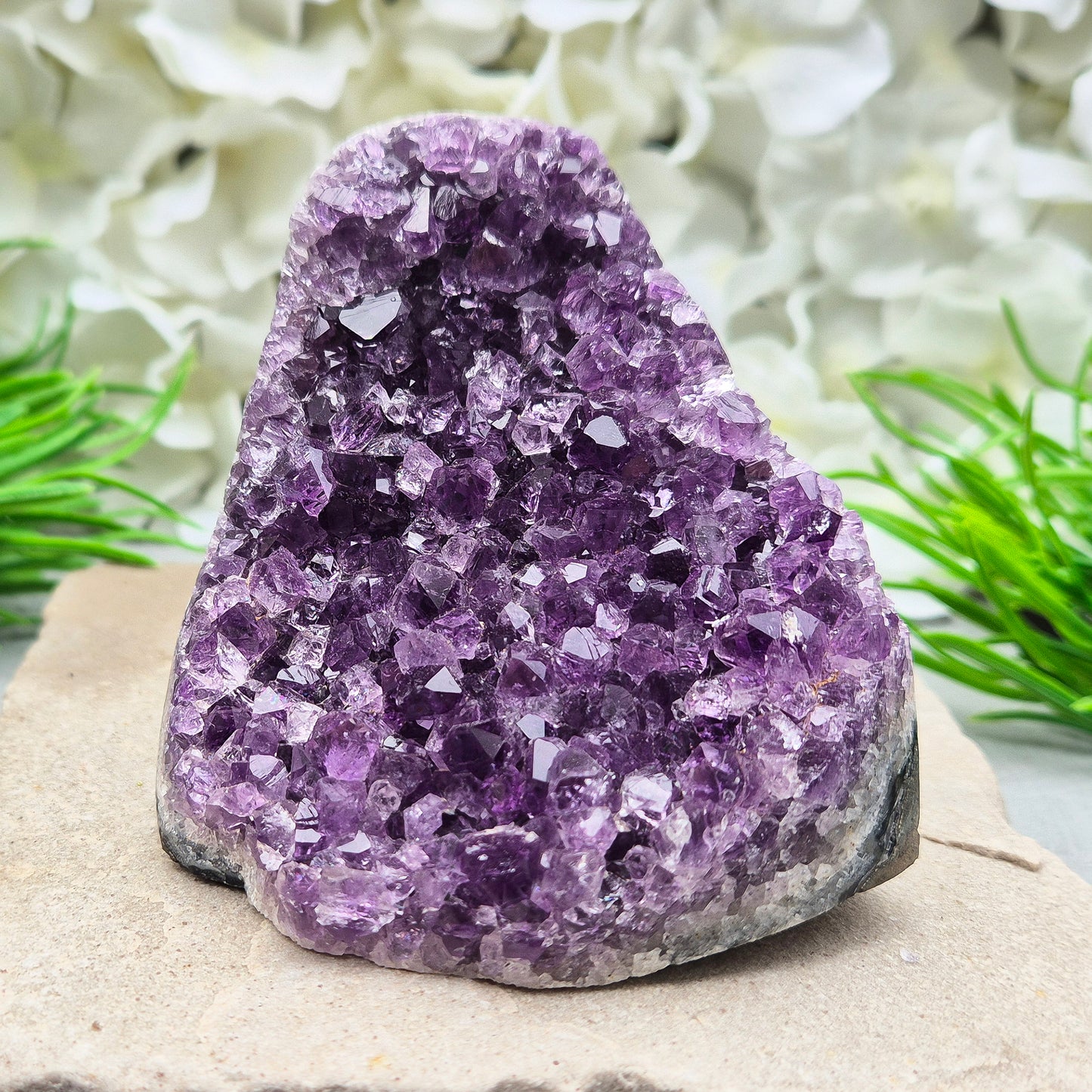 Amethyst Self-Standing Geode. This beautiful self-standing Amethyst Geode comes from Brazil. With its deep violet points and natural open-face formation, this piece offers both strength and serenity.