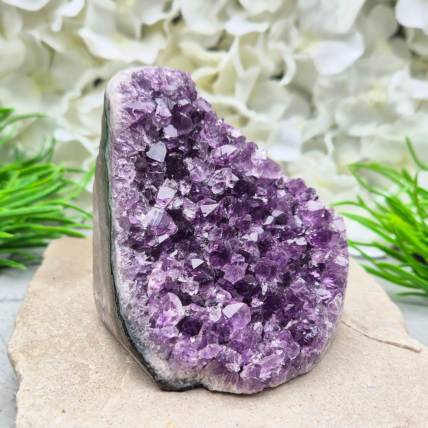 Amethyst Self-Standing Geode. This beautiful self-standing Amethyst Geode comes from Brazil. With its deep violet points and natural open-face formation, this piece offers both strength and serenity.
