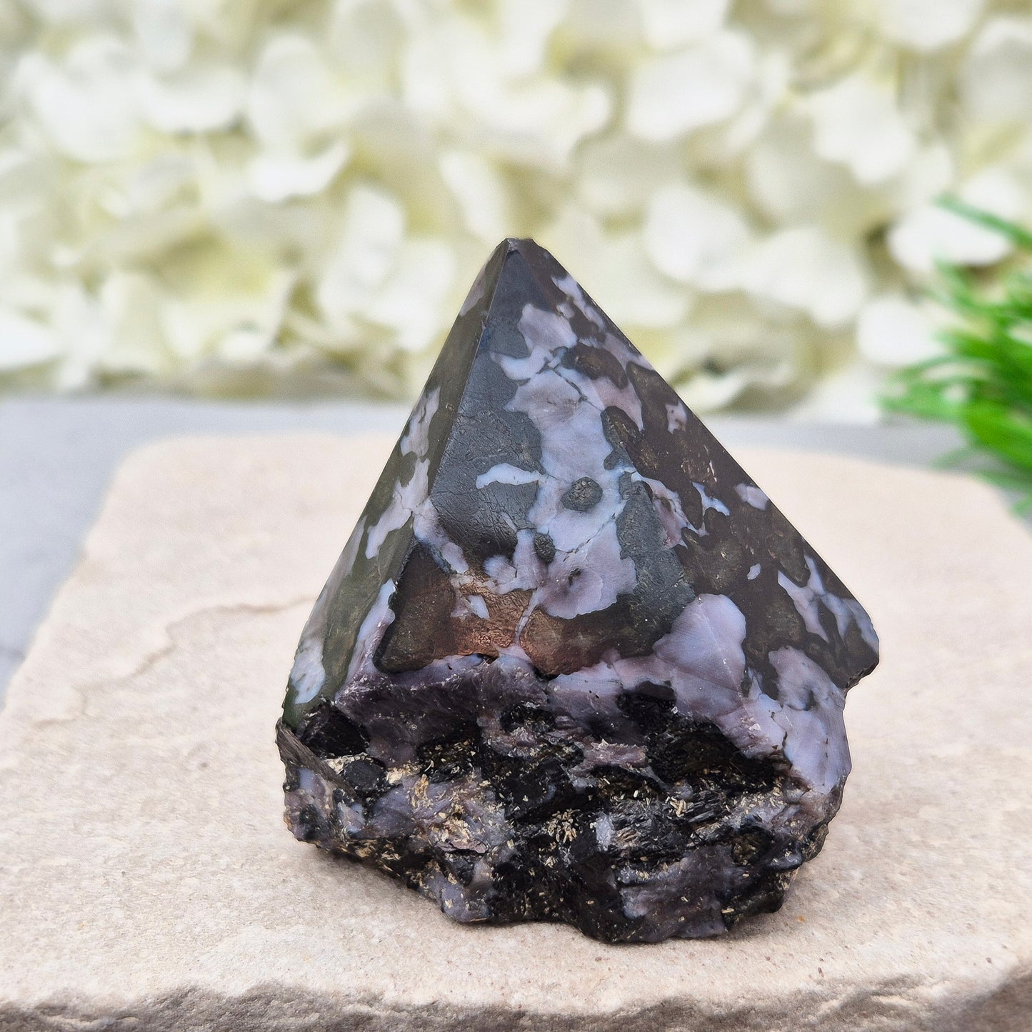 Indigo Gabbro Crystal Point (Mystic Merlinite) from Madagascar. This Indigo Gabbro point features a mix of dark black and deep purple colours. The top is polished, the base cut flat, and the sides left natural.