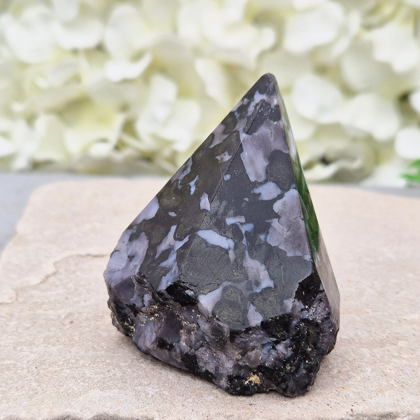 Indigo Gabbro Crystal Point (Mystic Merlinite) from Madagascar. This Indigo Gabbro point features a mix of dark black and deep purple colours. The top is polished, the base cut flat, and the sides left natural.