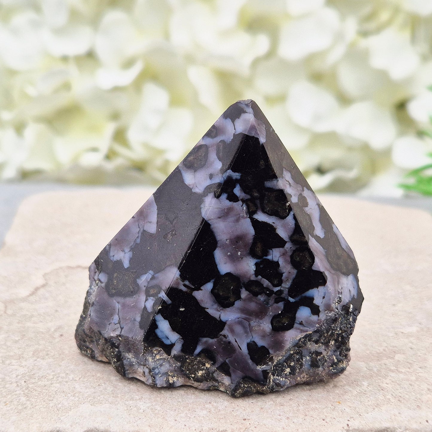 Indigo Gabbro Crystal Point (Mystic Merlinite) from Madagascar. This Indigo Gabbro point features a mix of dark black and deep purple colours. The top is polished, the base cut flat, and the sides left natural.