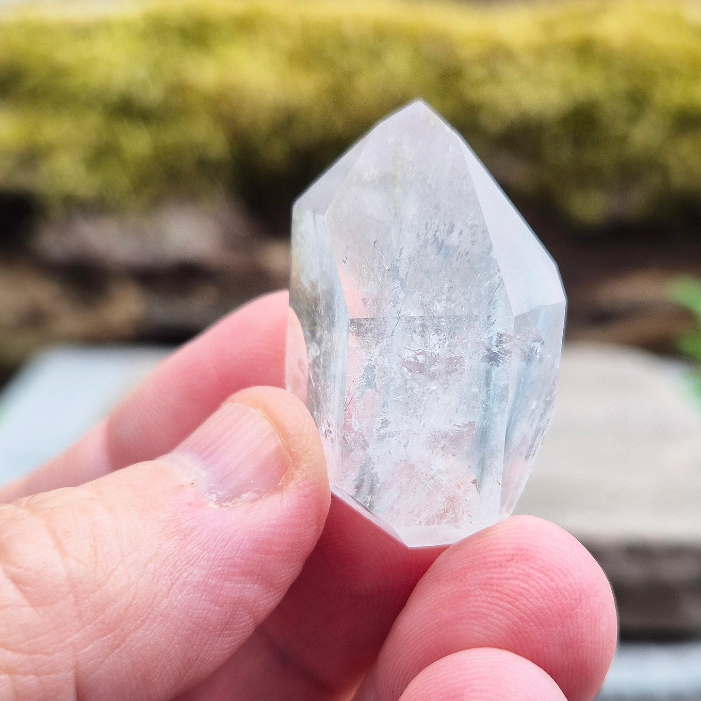Blue Tara, also known as Indicolite Quartz, is a rare and visually captivating crystal from Brazil. This polished piece features fine, natural inclusions of Blue Tourmaline suspended like mist or needles within clear Quartz.