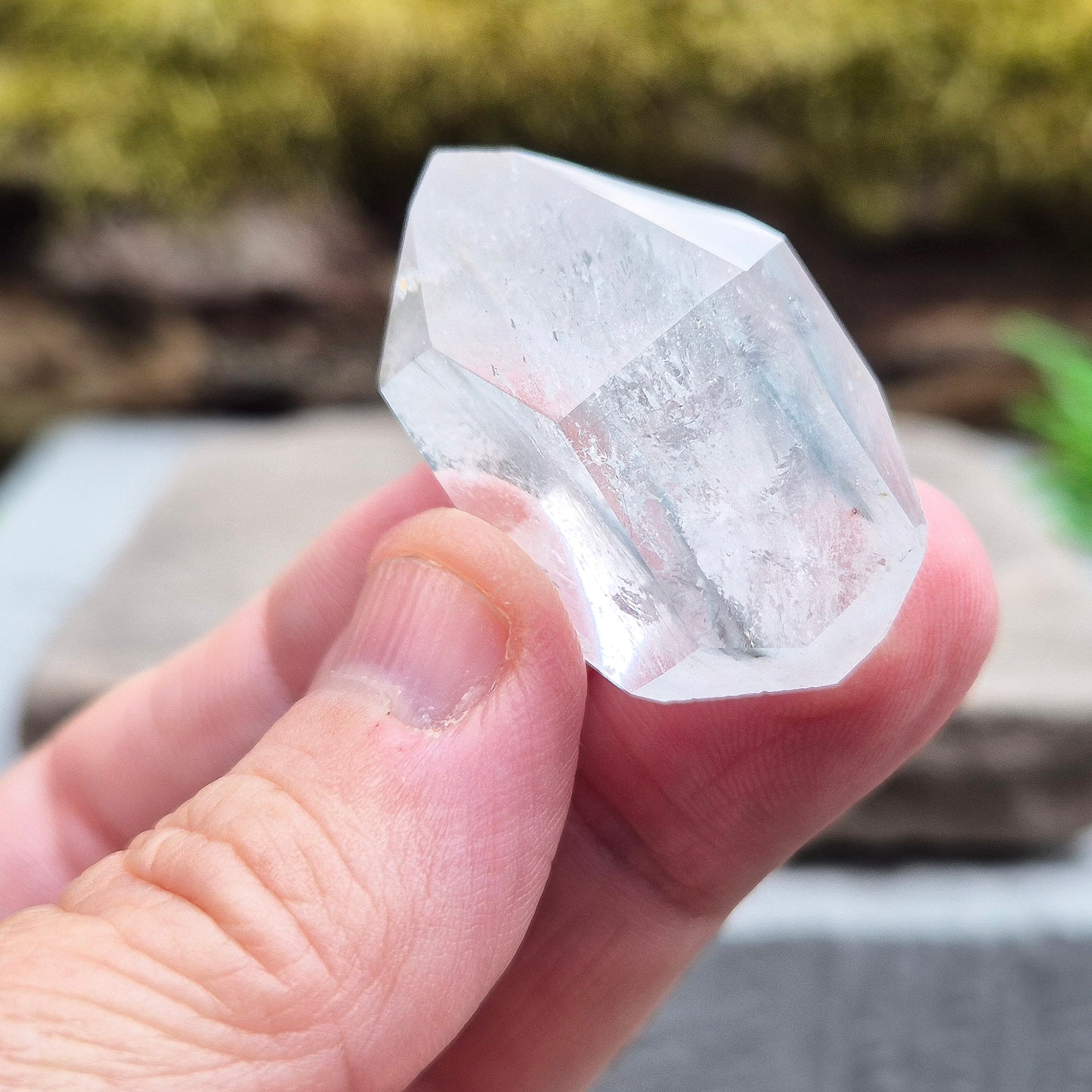 Blue Tara, also known as Indicolite Quartz, is a rare and visually captivating crystal from Brazil. This polished piece features fine, natural inclusions of Blue Tourmaline suspended like mist or needles within clear Quartz.