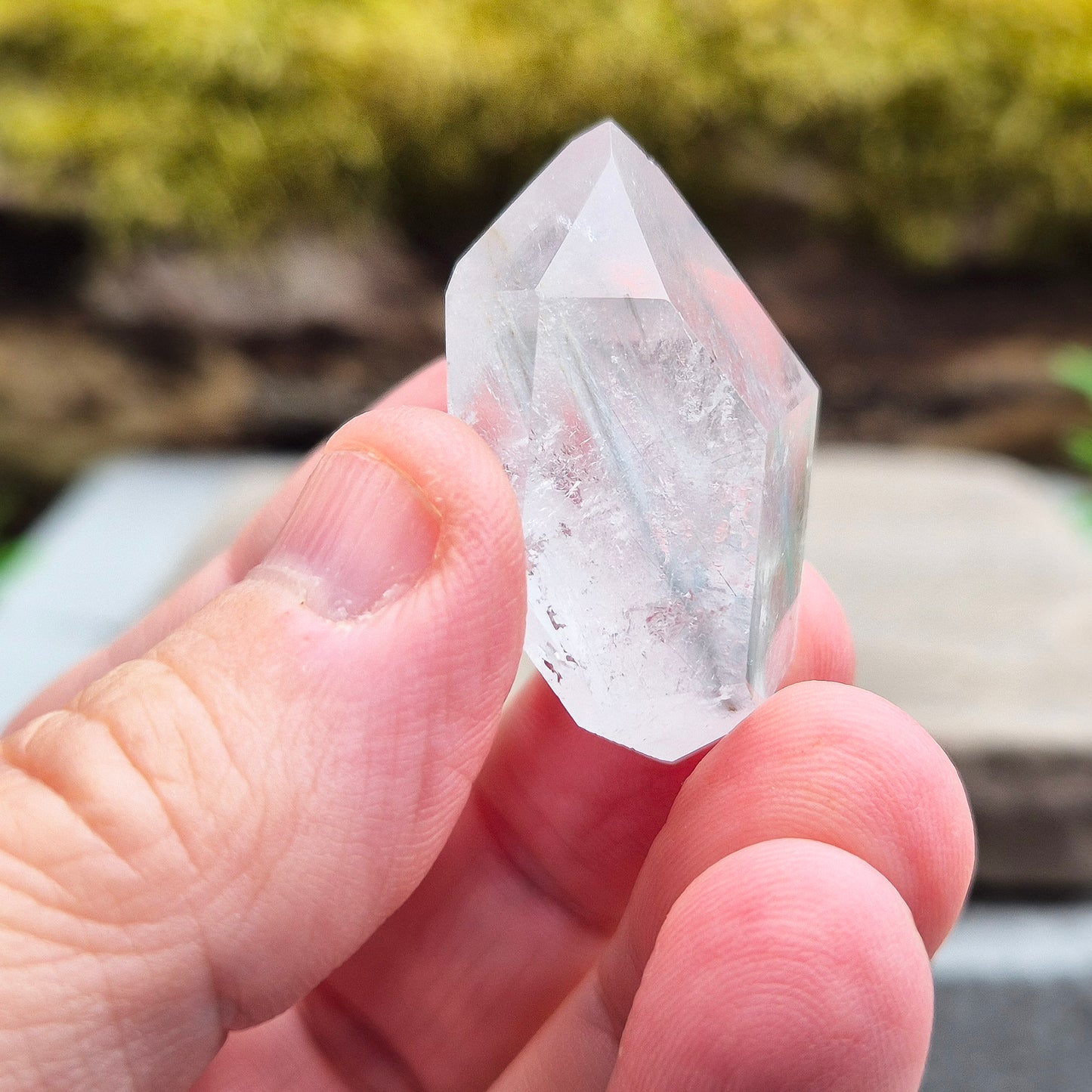 Blue Tara, also known as Indicolite Quartz, is a rare and visually captivating crystal from Brazil. This polished piece features fine, natural inclusions of Blue Tourmaline suspended like mist or needles within clear Quartz.