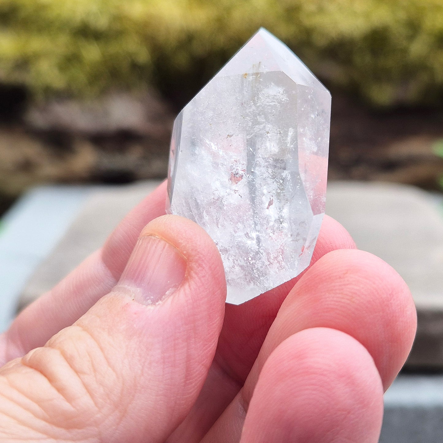 Blue Tara, also known as Indicolite Quartz, is a rare and visually captivating crystal from Brazil. This polished piece features fine, natural inclusions of Blue Tourmaline suspended like mist or needles within clear Quartz.