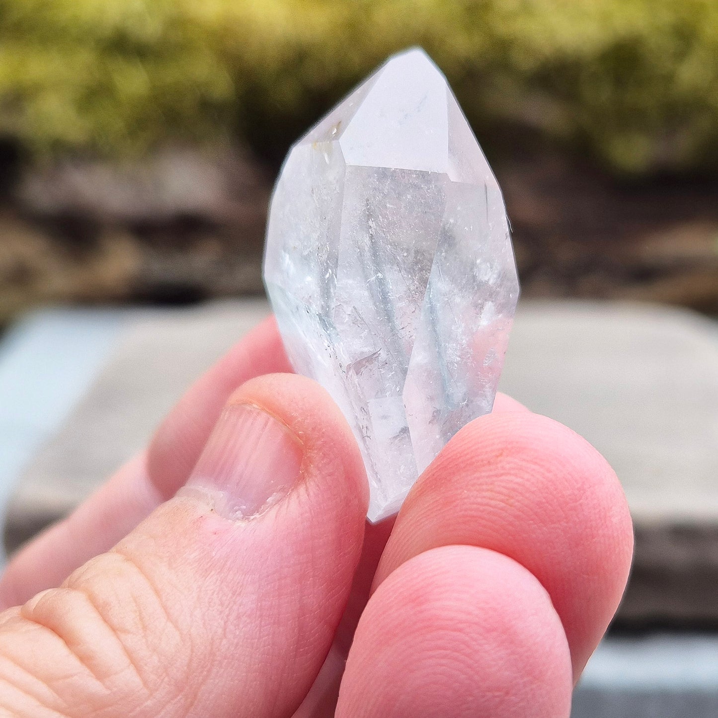 Blue Tara, also known as Indicolite Quartz, is a rare and visually captivating crystal from Brazil. This polished piece features fine, natural inclusions of Blue Tourmaline suspended like mist or needles within clear Quartz.