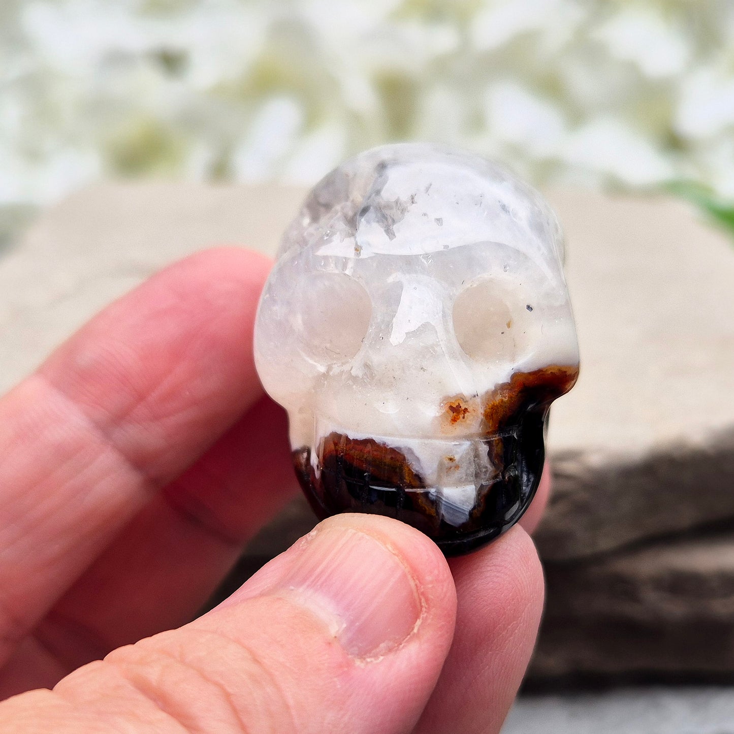 This polished Sardonyx Skull from Brazil carries the energy of ancestral knowledge, transformation, and clear inner vision — a steady reminder to stay strong in your truth while learning from the past. It features a beautiful natural cavity near the top on one side