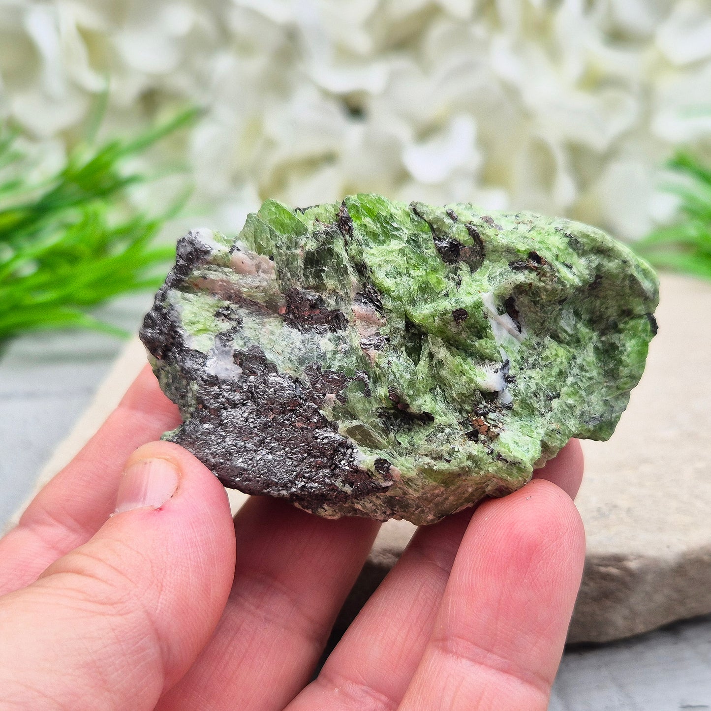 This truly rare natural green tremolite comes straight from the renowned Merelani Hills of Tanzania — the same region that gave us Tanzanite. It’s a stone of gentle energetic awakening, with soft green blades of tremolite.