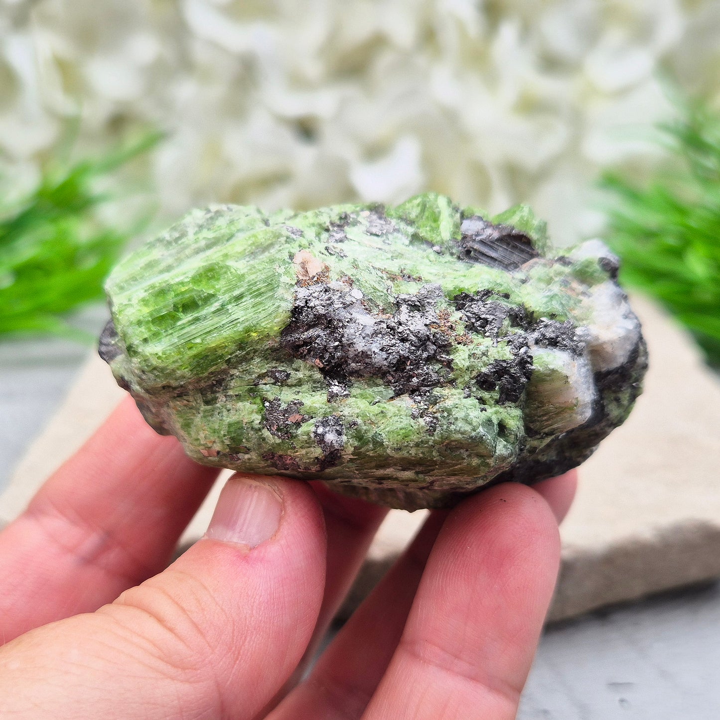 This truly rare natural green tremolite comes straight from the renowned Merelani Hills of Tanzania — the same region that gave us Tanzanite. It’s a stone of gentle energetic awakening, with soft green blades of tremolite.