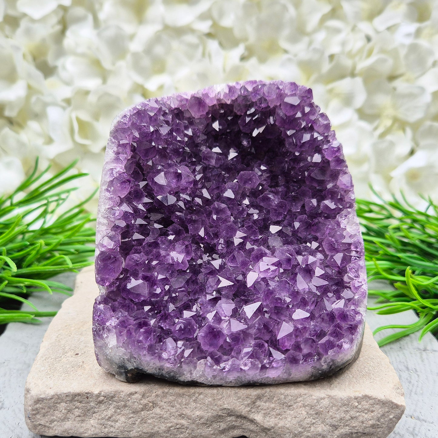 This beautiful self-standing Amethyst Geode from Brazil features lovely purple points and a natural open-face formation.