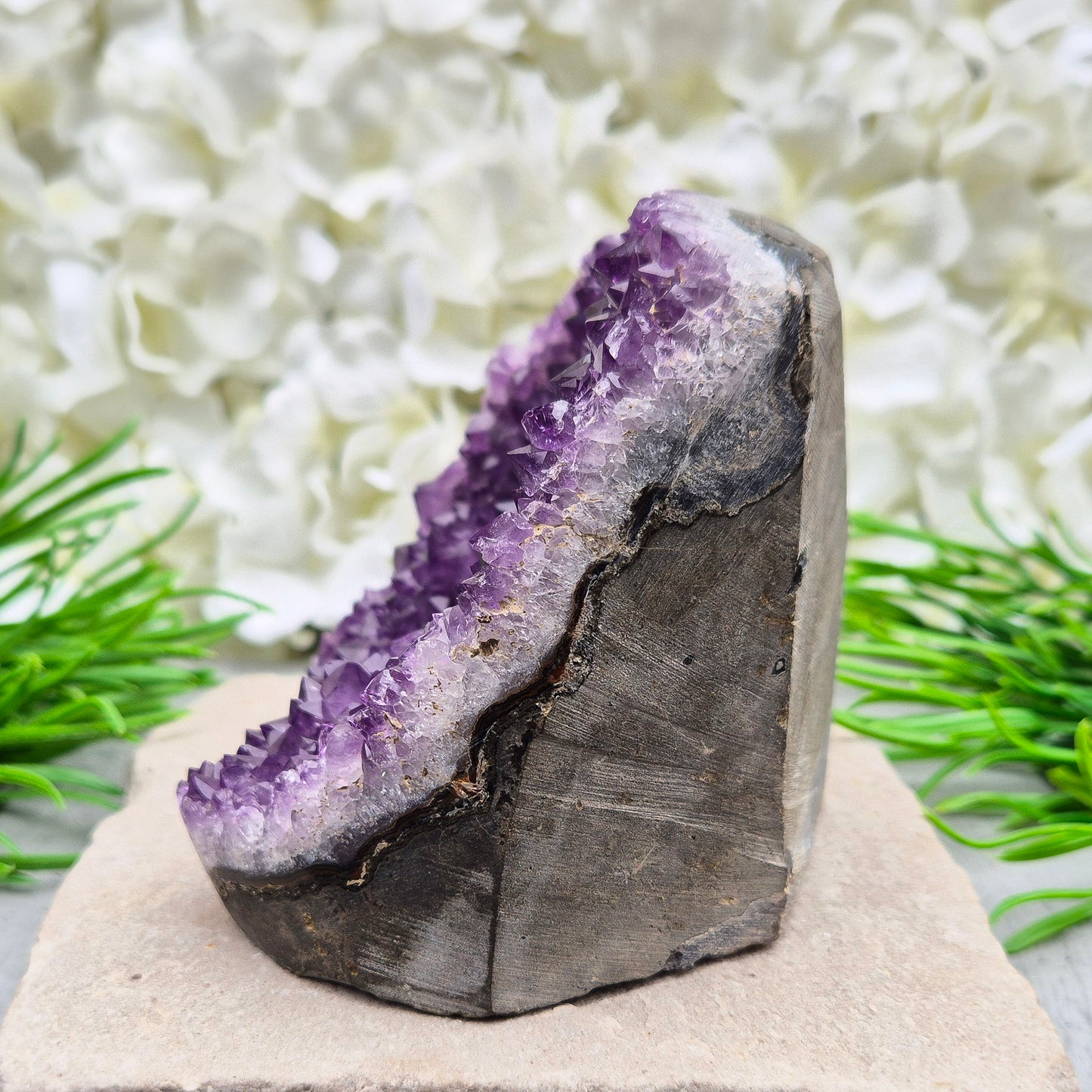 This beautiful self-standing Amethyst Geode from Brazil features lovely purple points and a natural open-face formation.