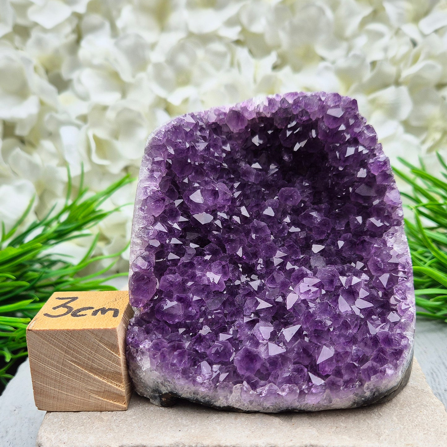 This beautiful self-standing Amethyst Geode from Brazil features lovely purple points and a natural open-face formation.
