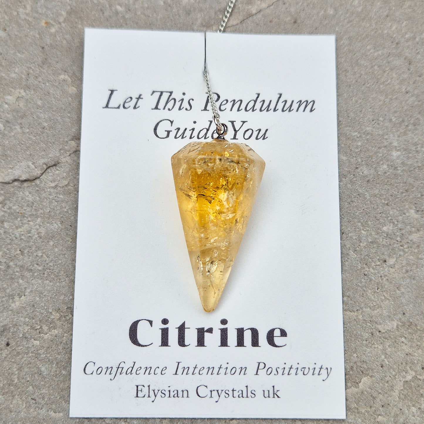 Citrine Crystal Pendulum from Brazil. These stunning sunny pendulums carry the warm, golden glow Citrine is loved for. Each has a yellow bead at the end of the chain making it comfortable to hold and easy to use.