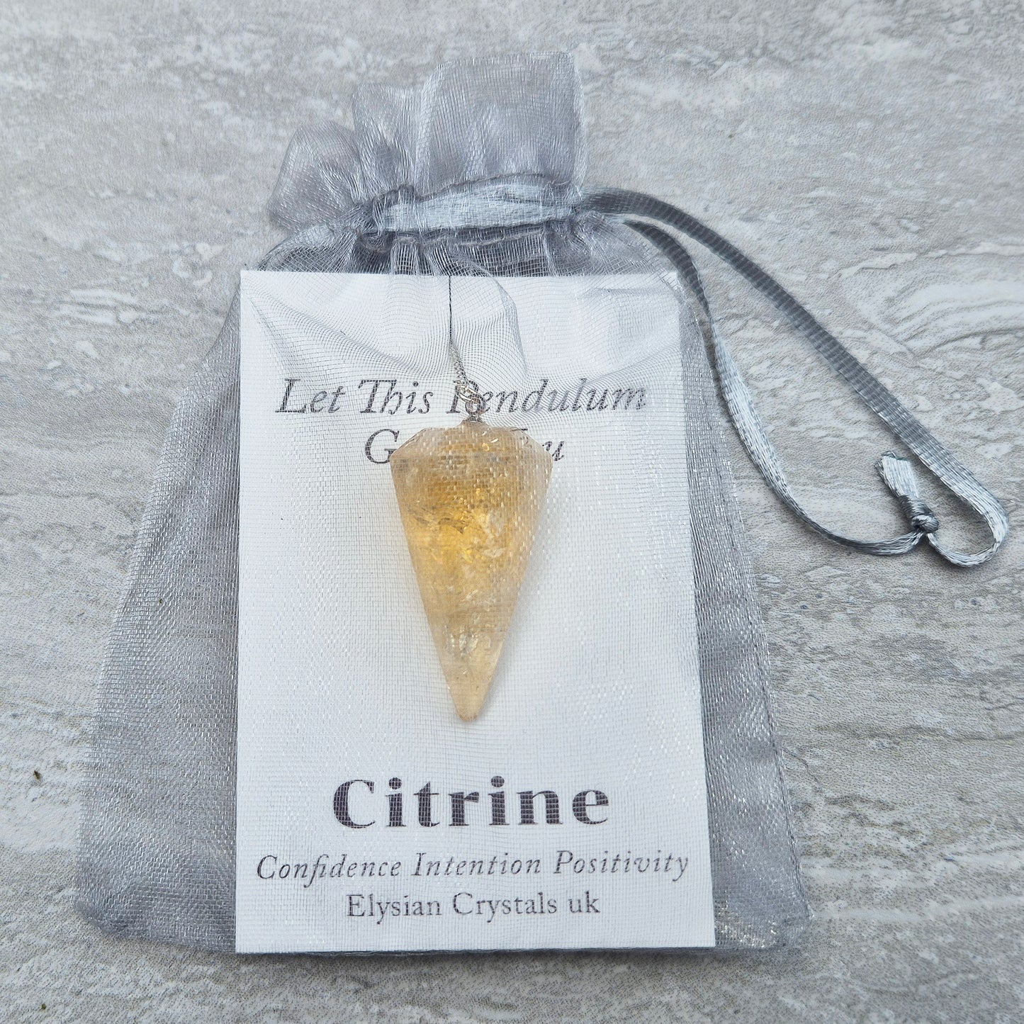 Citrine Crystal Pendulum from Brazil. These stunning sunny pendulums carry the warm, golden glow Citrine is loved for. Each has a yellow bead at the end of the chain making it comfortable to hold and easy to use.