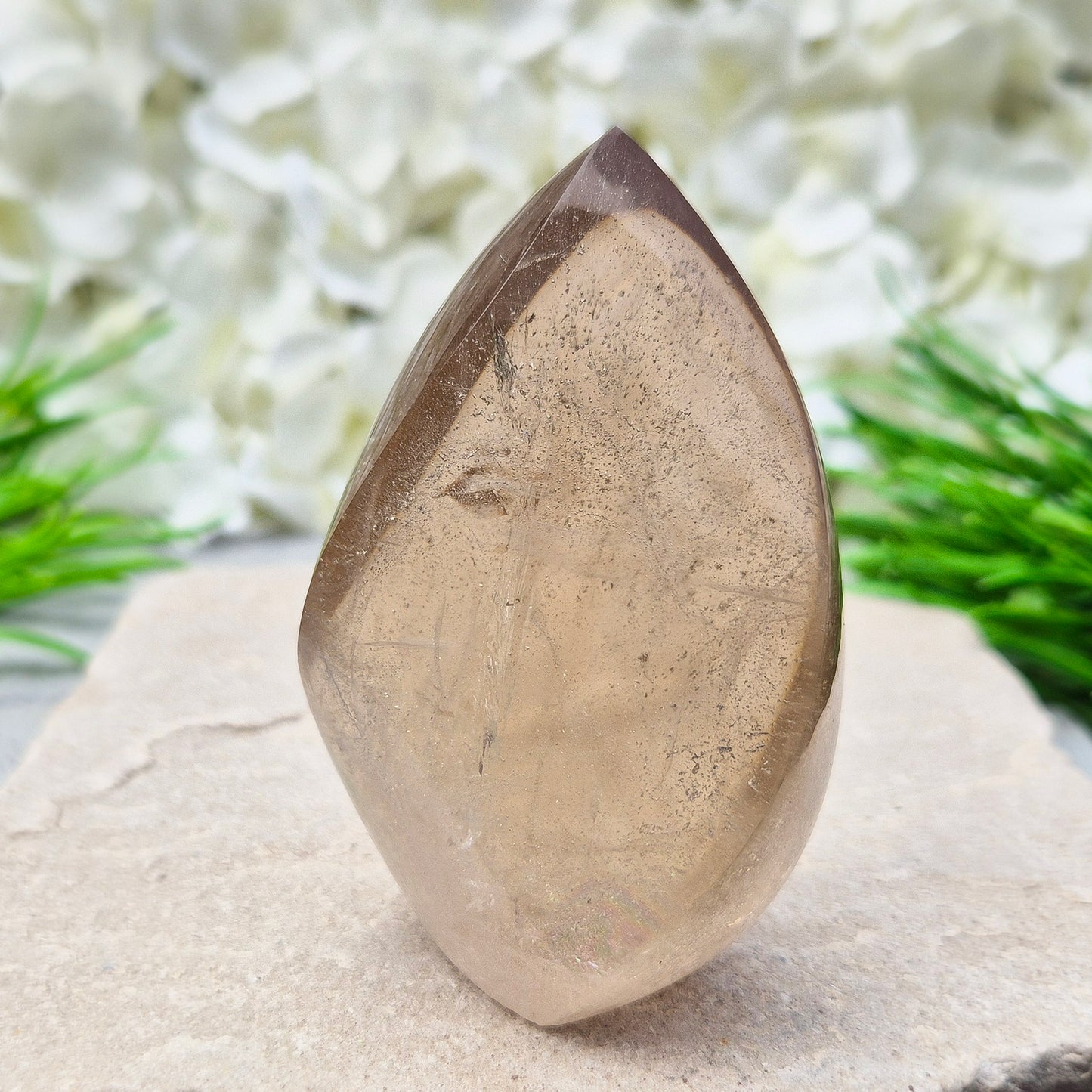 This polished Smoky Quartz Crystal Flame from Brazil features a light brown tone with subtle, light-reflecting inclusions and an amazing rainbow. It’s not heat-treated — this is genuine, naturally formed Smoky Quartz.