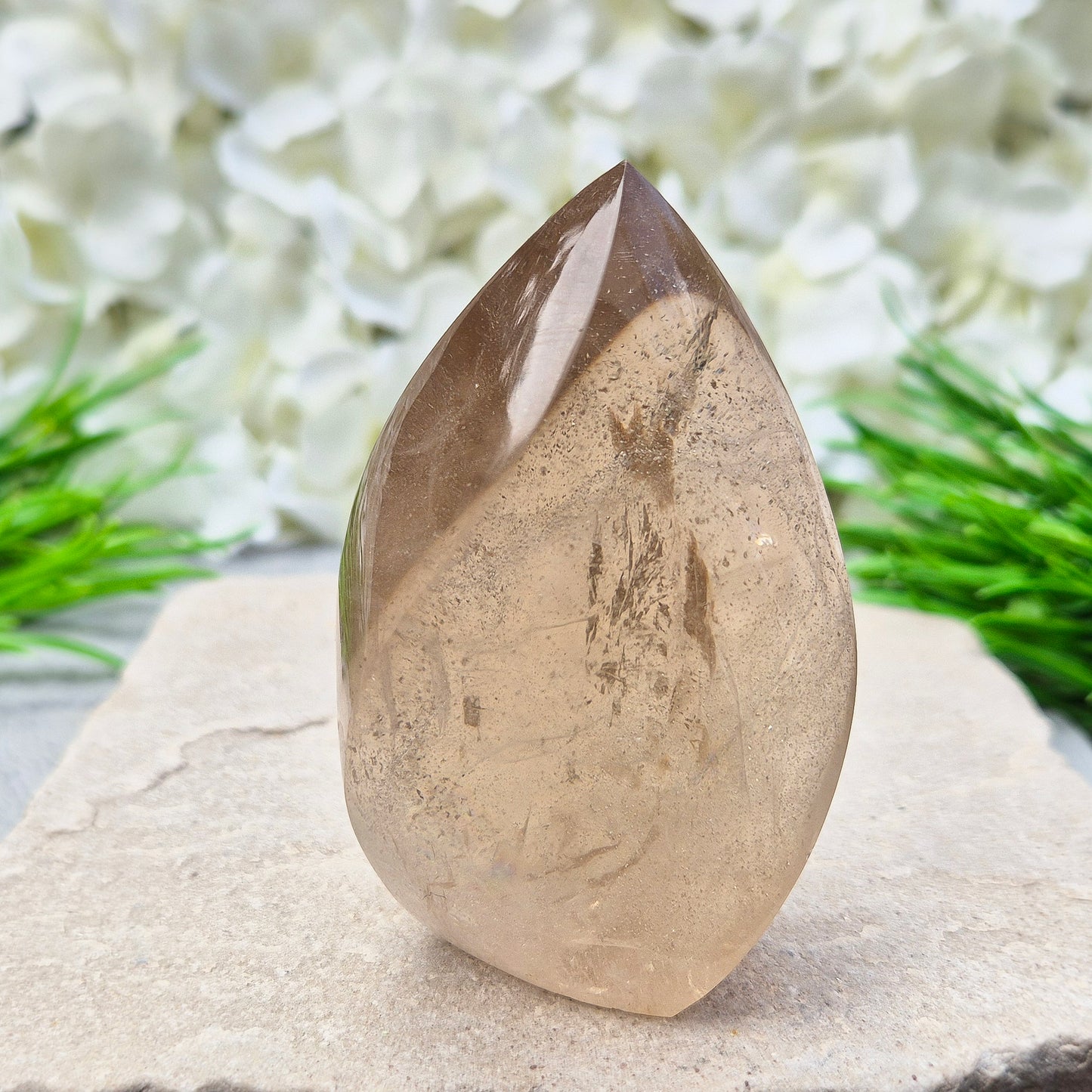 This polished Smoky Quartz Crystal Flame from Brazil features a light brown tone with subtle, light-reflecting inclusions and an amazing rainbow. It’s not heat-treated — this is genuine, naturally formed Smoky Quartz.