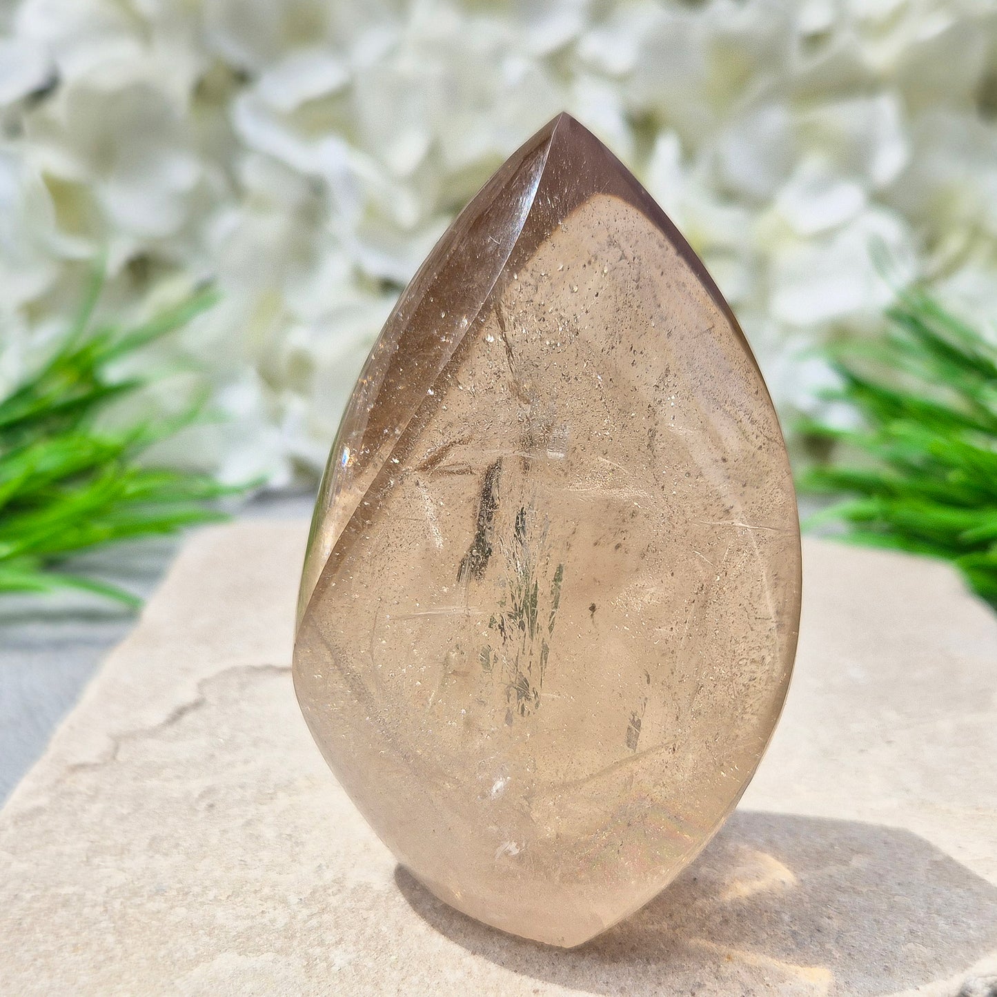 This polished Smoky Quartz Crystal Flame from Brazil features a light brown tone with subtle, light-reflecting inclusions and an amazing rainbow. It’s not heat-treated — this is genuine, naturally formed Smoky Quartz.
