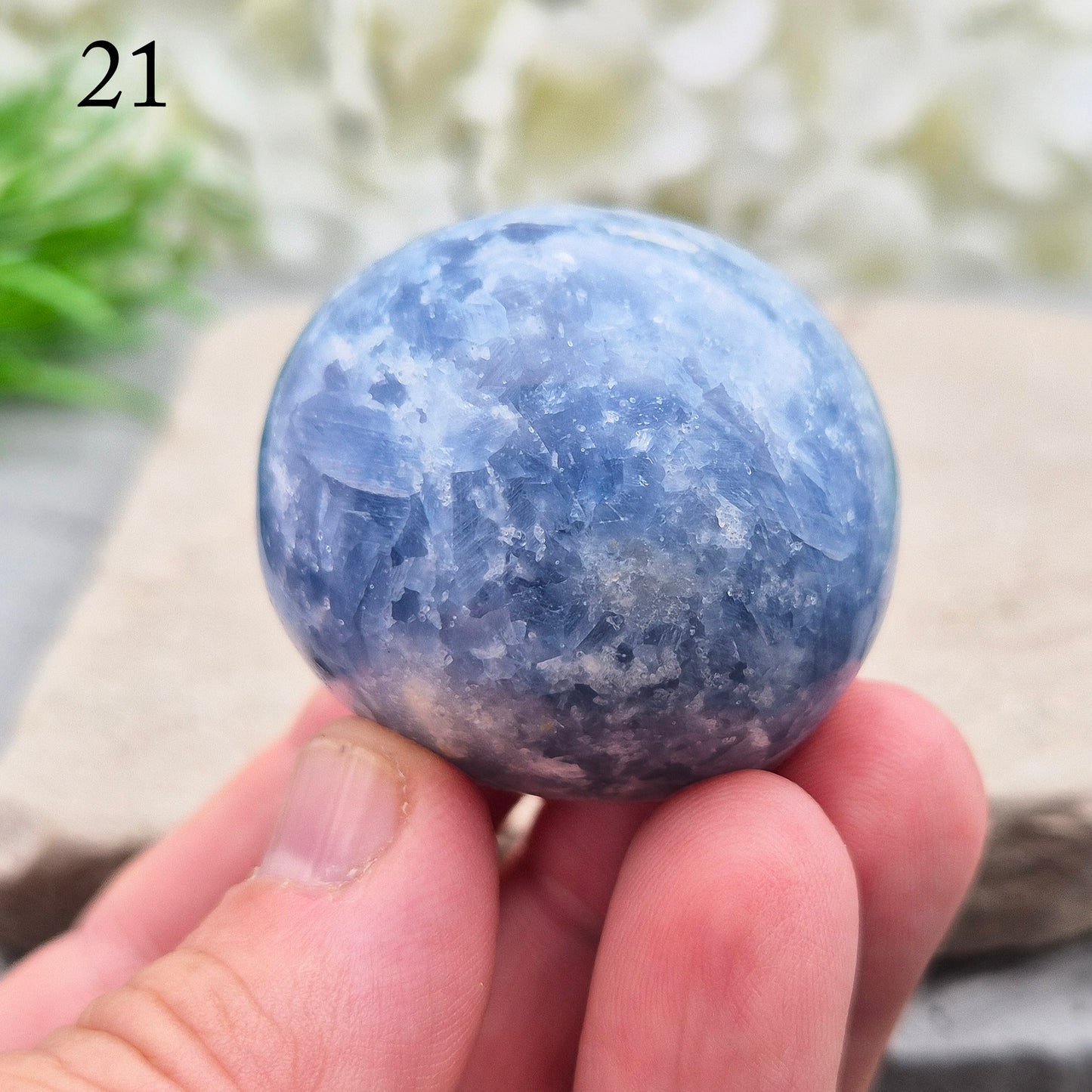 This polished Blue Calcite crystal from Madagascar has a lovely blue colouring and a rounded, gently domed shape that fits naturally into the palm. It carries a comforting, wave-like energy — peaceful, steady, and easy to be around.