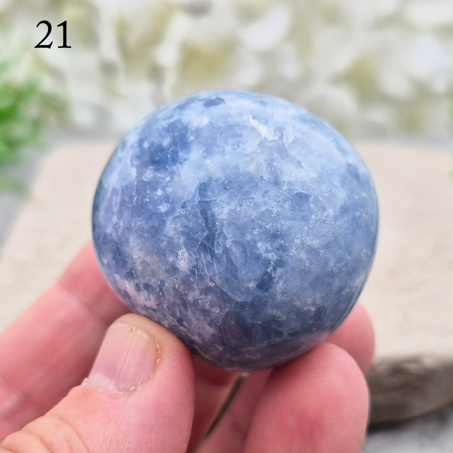 This polished Blue Calcite crystal from Madagascar has a lovely blue colouring and a rounded, gently domed shape that fits naturally into the palm. It carries a comforting, wave-like energy — peaceful, steady, and easy to be around.