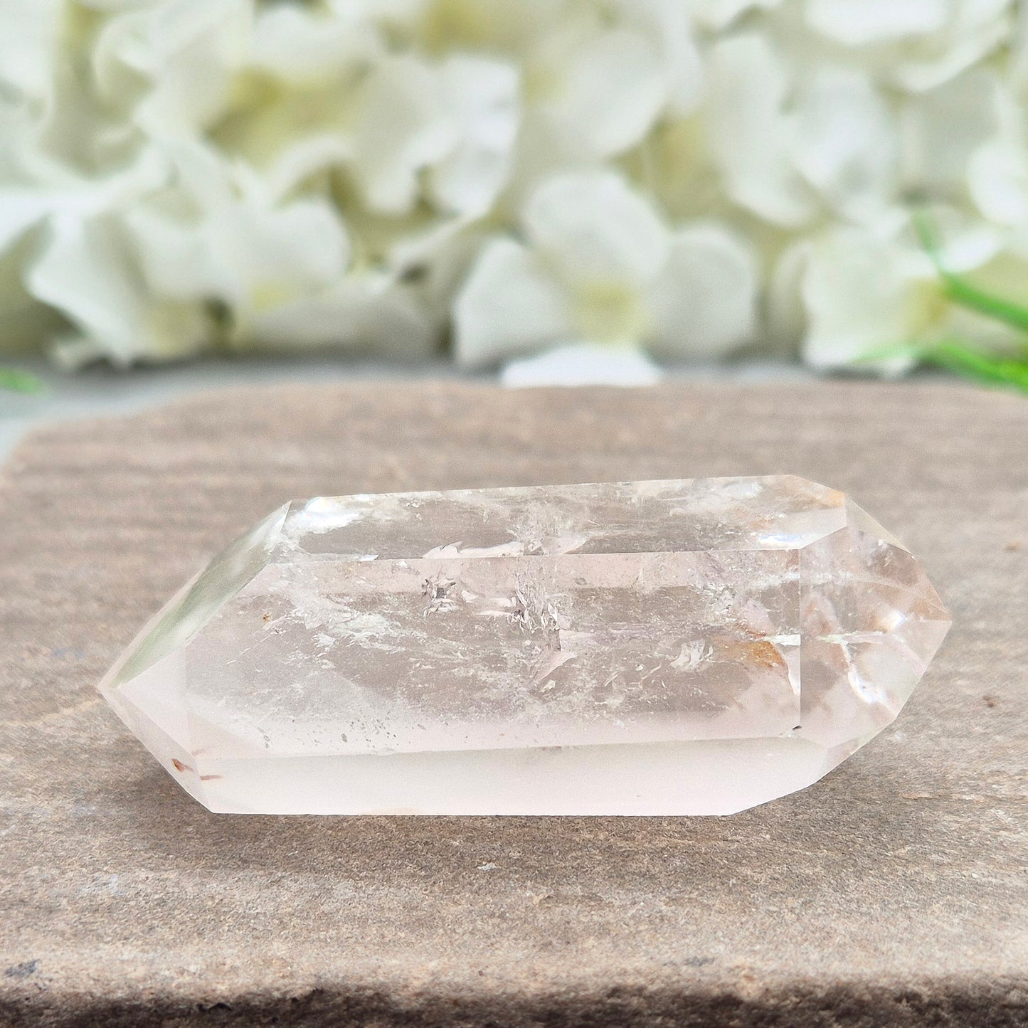 Quartz Crystal Double Terminated Wand, has a rainbow within it bringing a joyous nurturing vibration to an already great healing tool. Two sides are frosted.