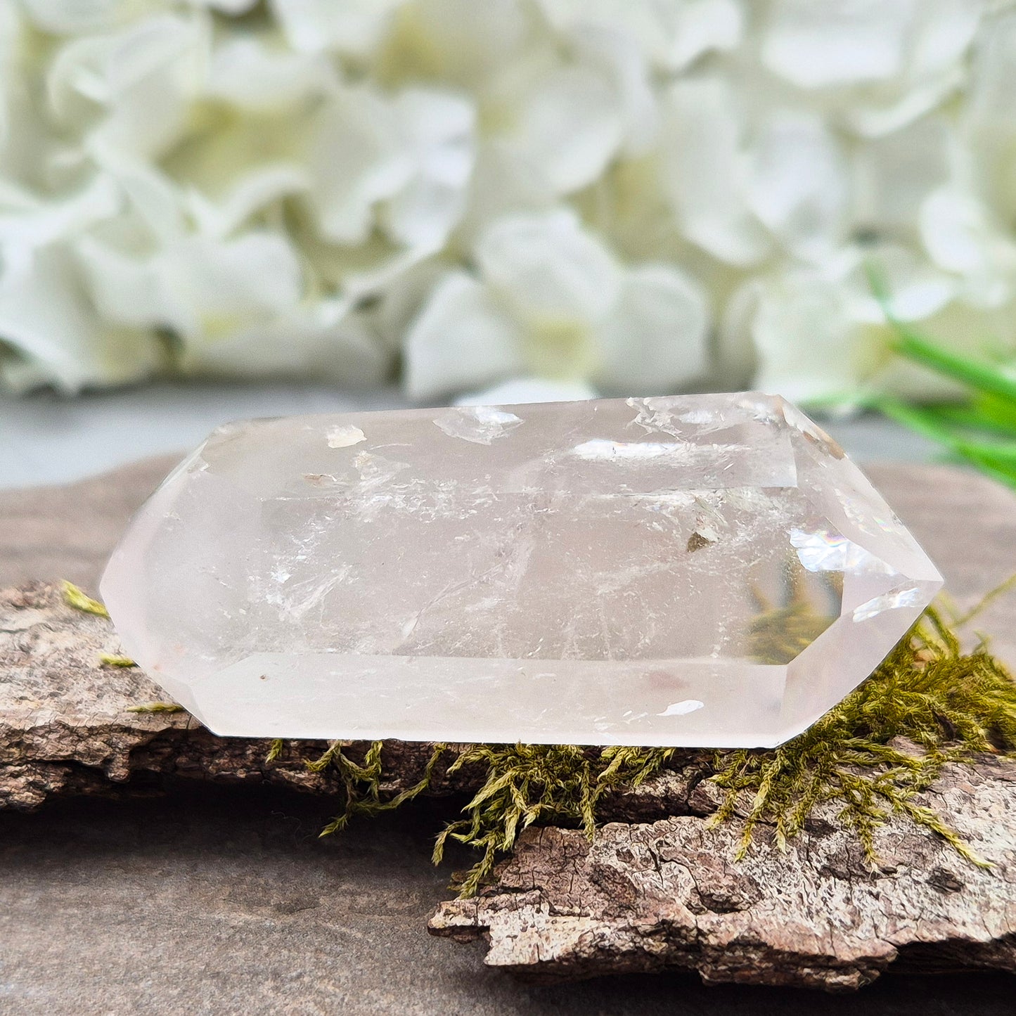 Quartz Crystal Double Terminated Wand, has a rainbow within it bringing a joyous nurturing vibration to an already great healing tool. Two sides are frosted.