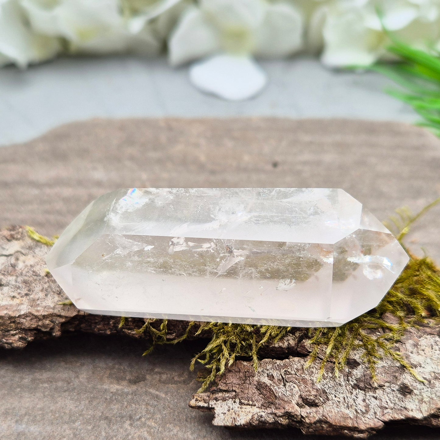 Quartz Crystal Double Terminated Wand, has a rainbow within it bringing a joyous nurturing vibration to an already great healing tool. Two sides are frosted.