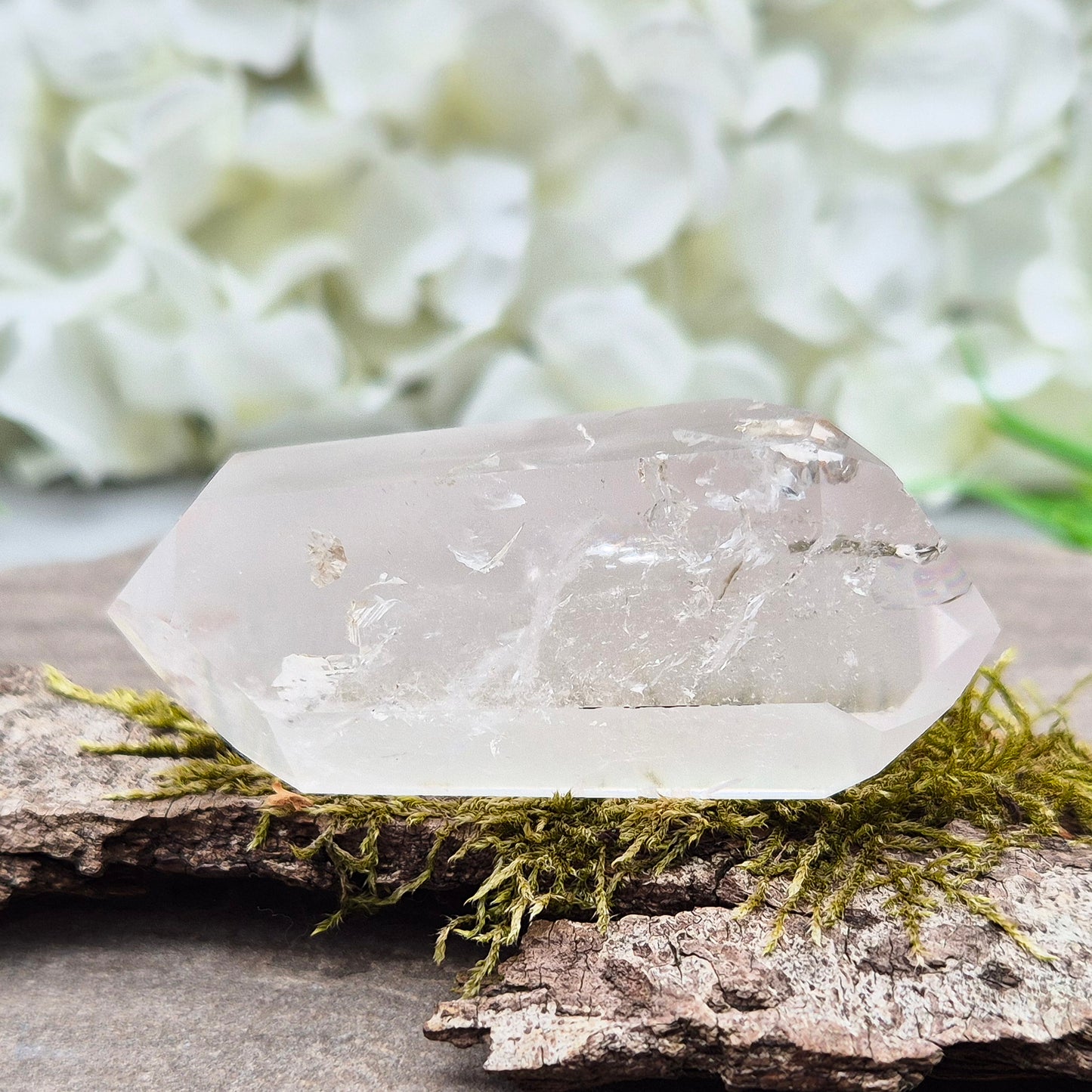 Quartz Crystal Double Terminated Wand, has a rainbow within it bringing a joyous nurturing vibration to an already great healing tool. Two sides are frosted.