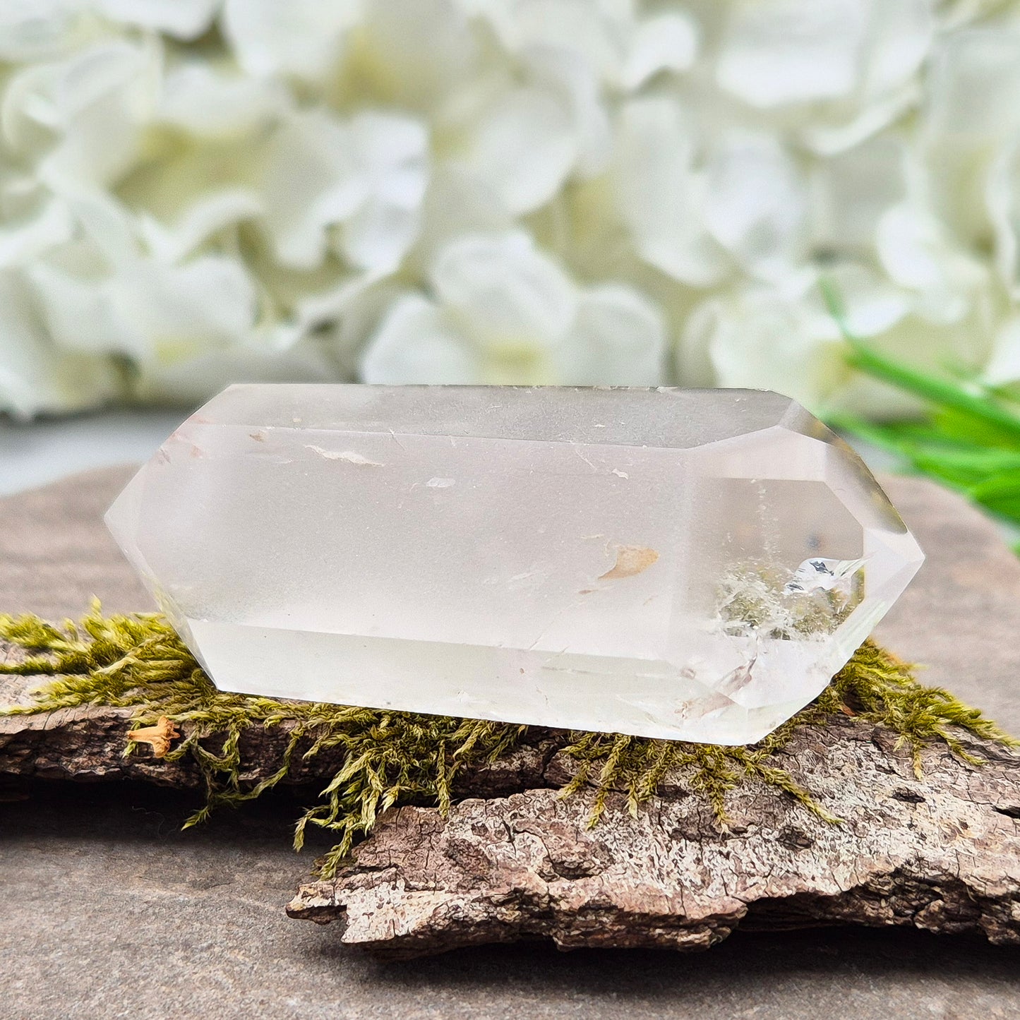 Quartz Crystal Double Terminated Wand, has a rainbow within it bringing a joyous nurturing vibration to an already great healing tool. Two sides are frosted.