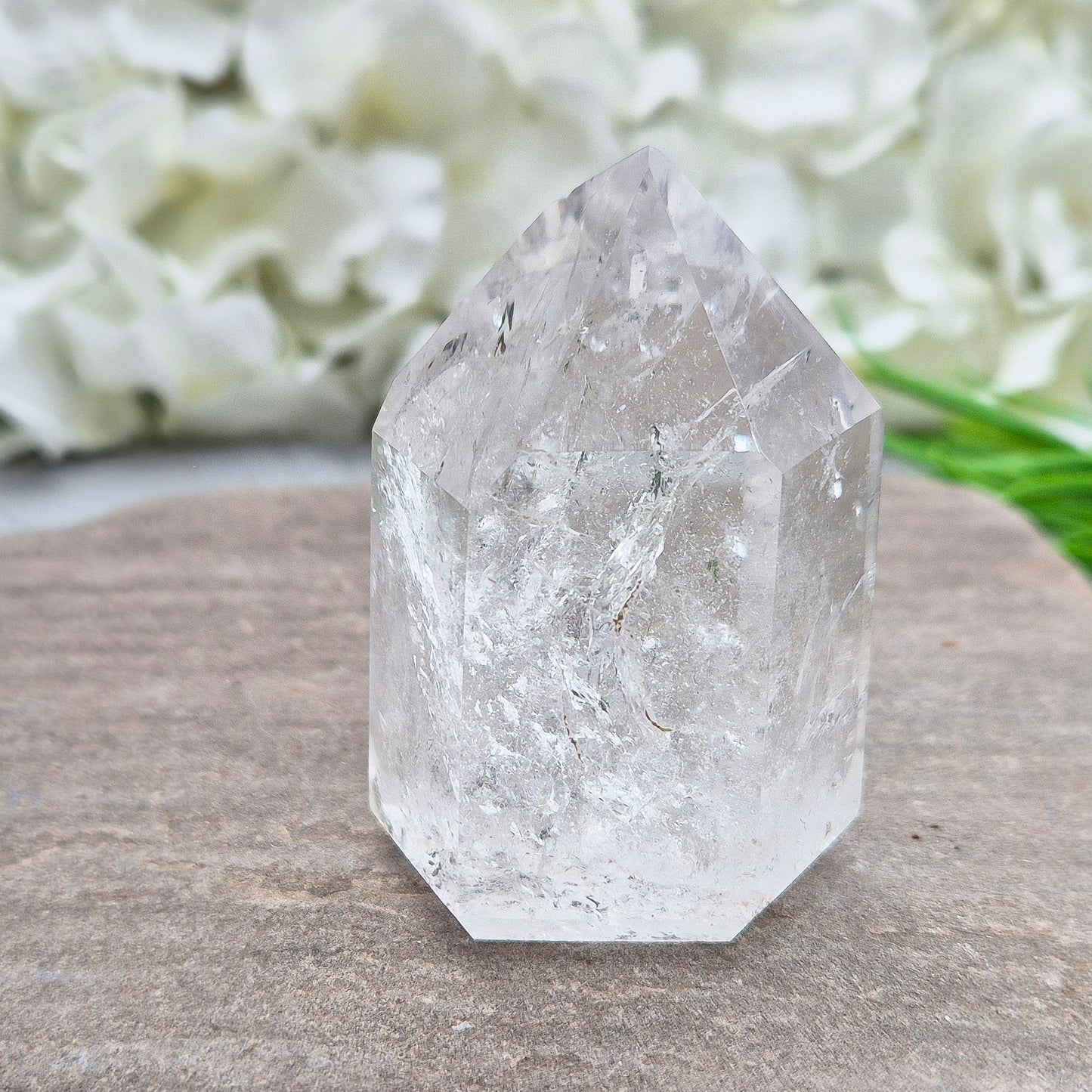 This Clear Quartz Polished Point is a radiant, light-filled crystal with clarity, sparkle, and high vibration A striking example of Brazilian Quartz.