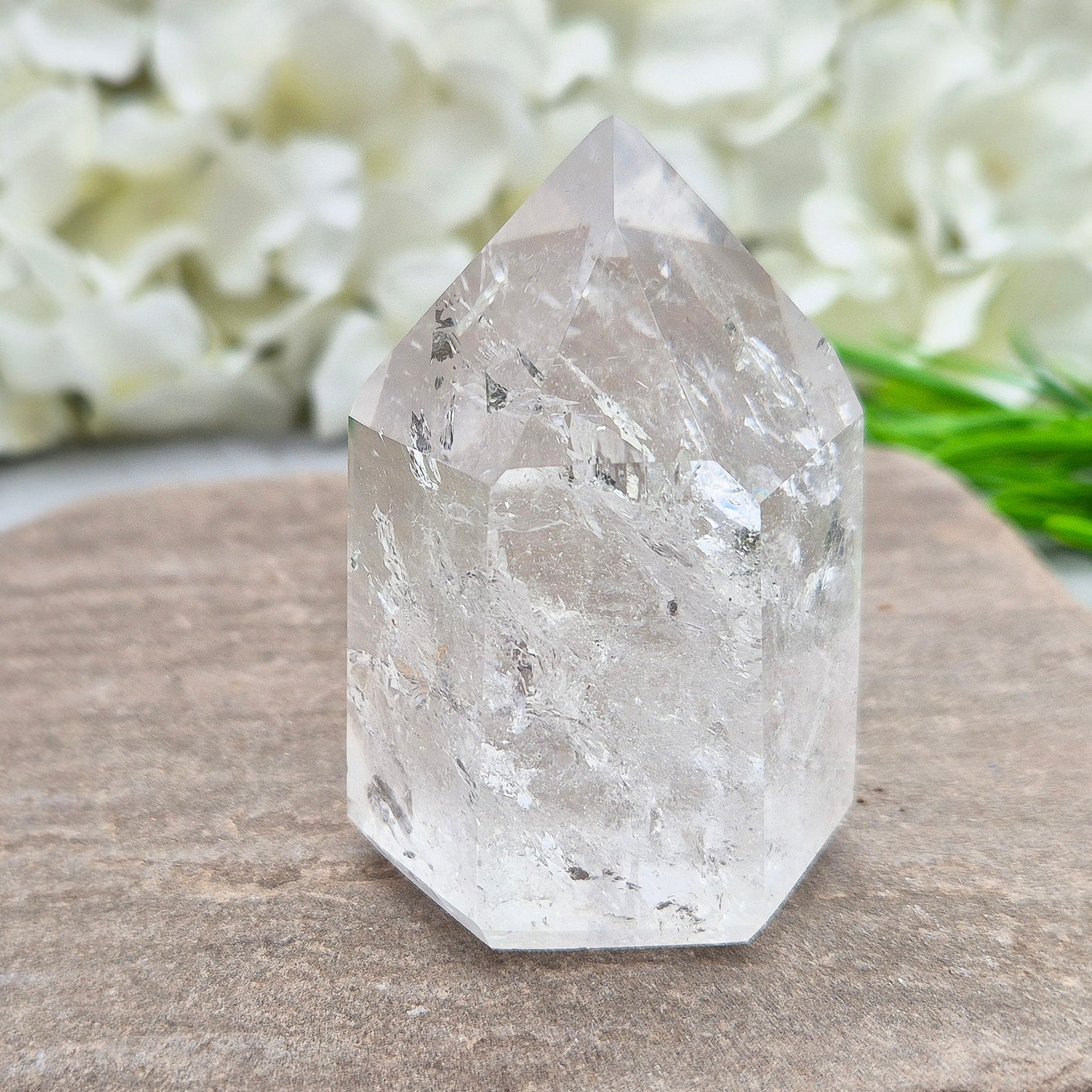 This Clear Quartz Polished Point is a radiant, light-filled crystal with clarity, sparkle, and high vibration A striking example of Brazilian Quartz.
