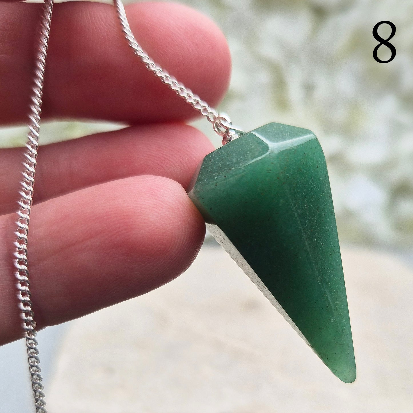 This beautiful Green Aventurine crystal pendulum features a Green Aventurine crystal pendulum and a green bead at the end of the chain.