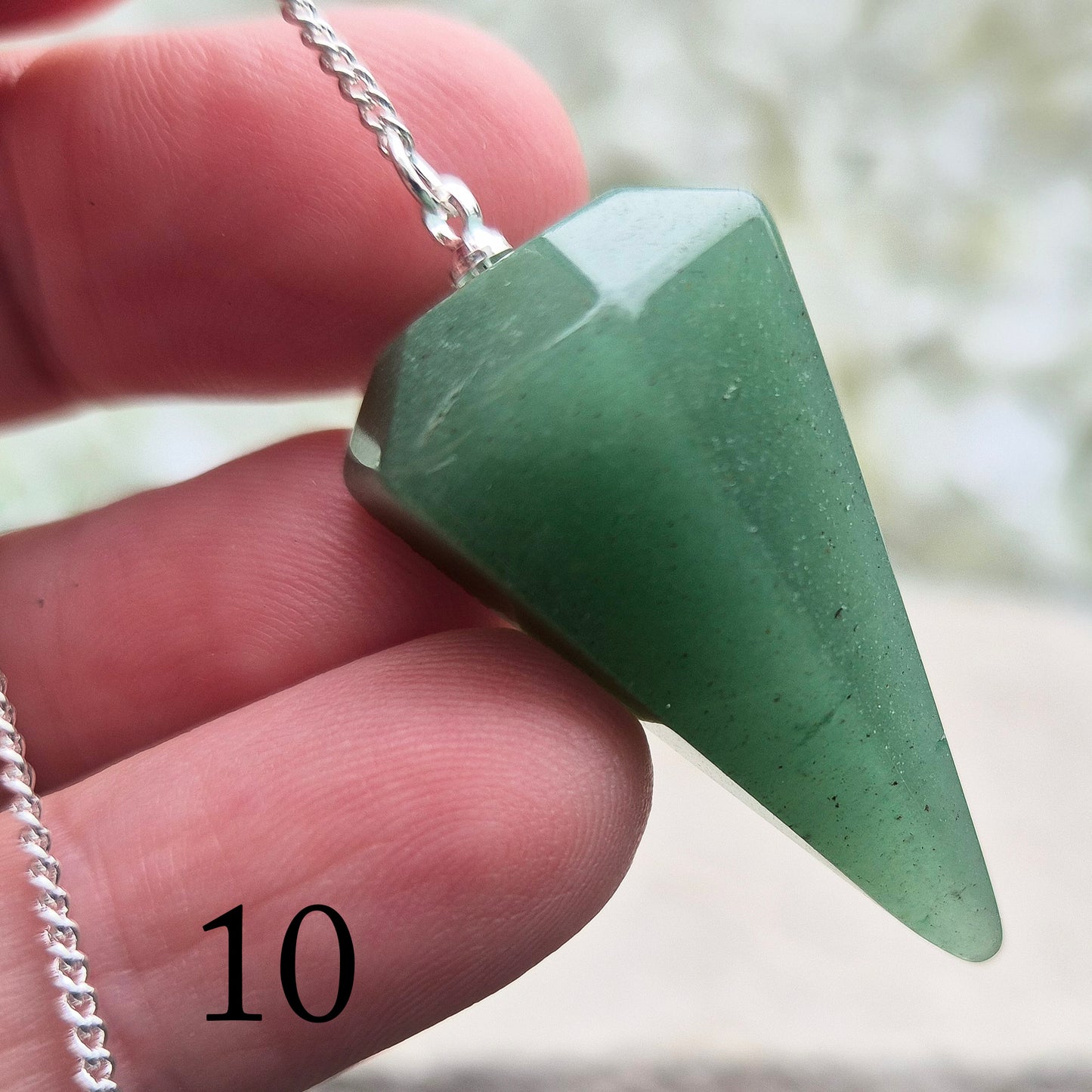 This beautiful Green Aventurine crystal pendulum features a Green Aventurine crystal pendulum and a green bead at the end of the chain.