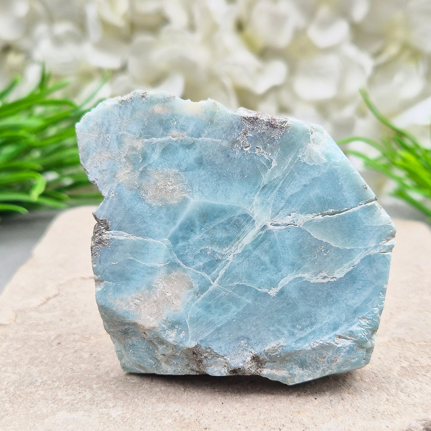Larimar Crystal. The front of this piece is cut and flat not highly polished so keeps a natural look to it and back of this piece is natural. From Dominican Republic. Also known as Dolphin Stone, Blue Pectolite