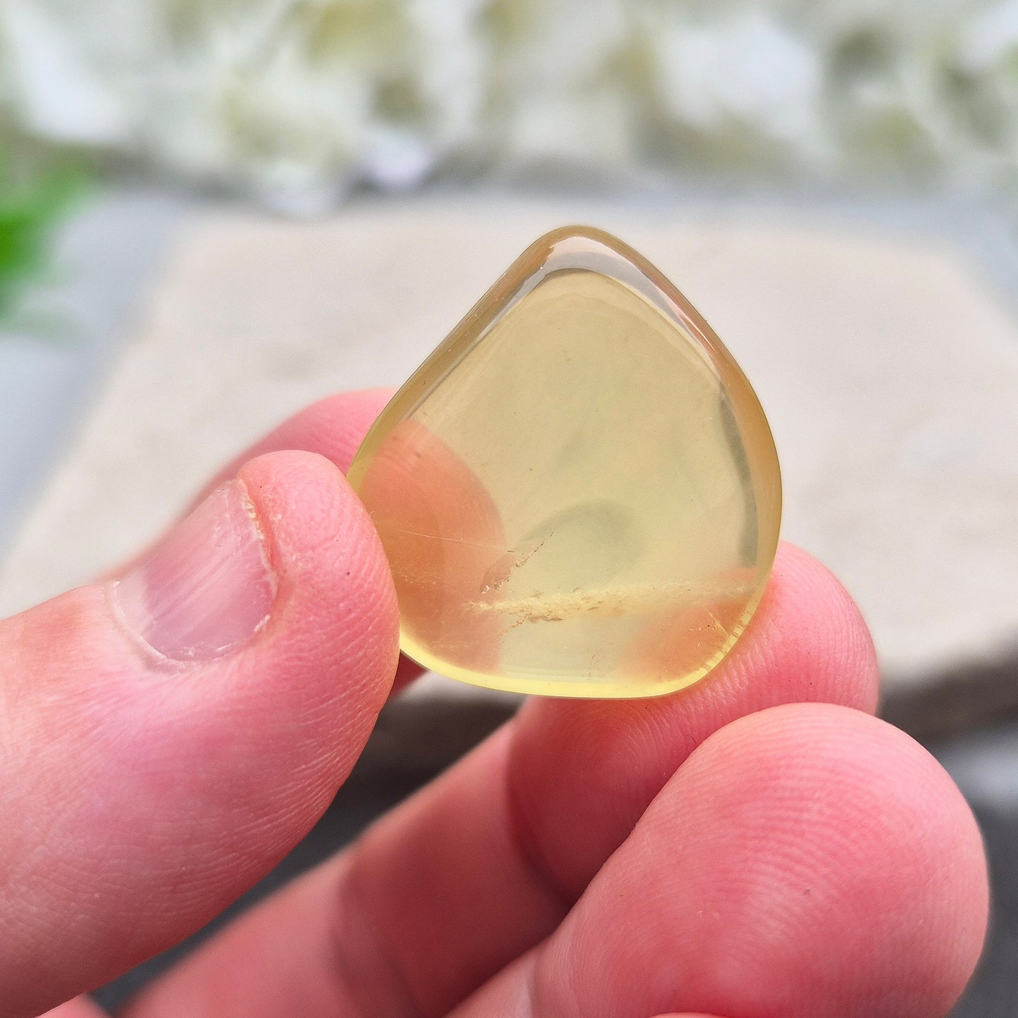A rarer form of quartz with a distinctive olive-green tone, this Ouro Verde Quartz comes ready to display in a clear sample box (which can be removed if you prefer to carry or grid with it).