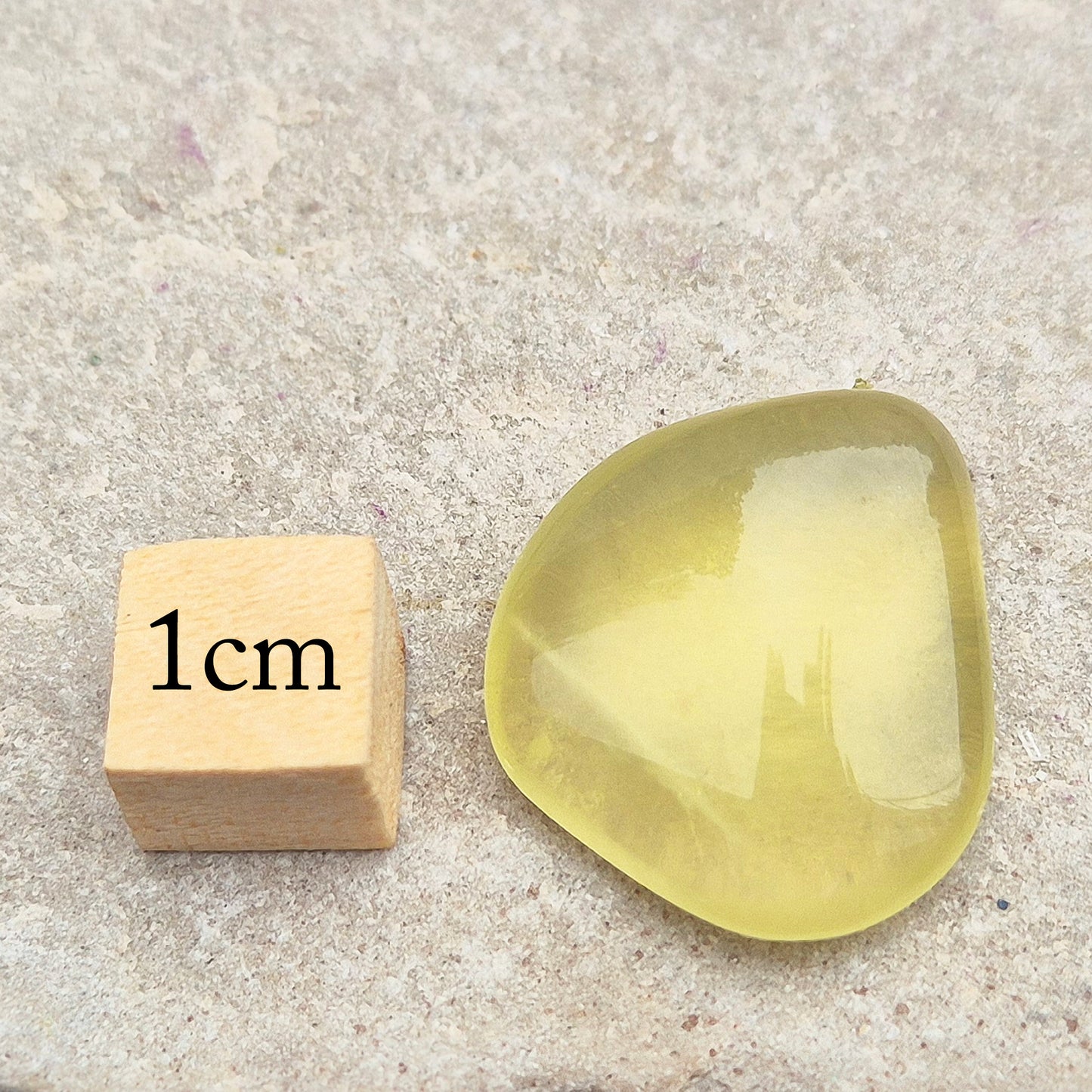 A rarer form of quartz with a distinctive olive-green tone, this Ouro Verde Quartz comes ready to display in a clear sample box (which can be removed if you prefer to carry or grid with it).